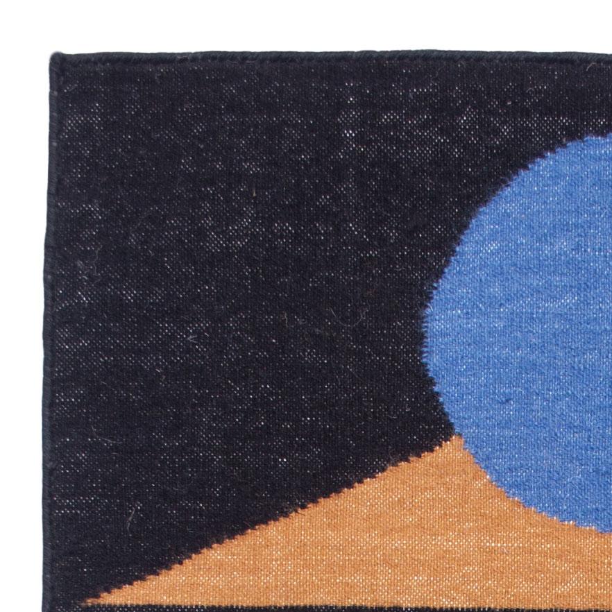 This geometric area rug has been ethically hand woven in the finest wool yarns by artisans in Rajasthan, India, using a traditional weaving technique which is native to this region.

The purchase of this handcrafted rug helps to support the