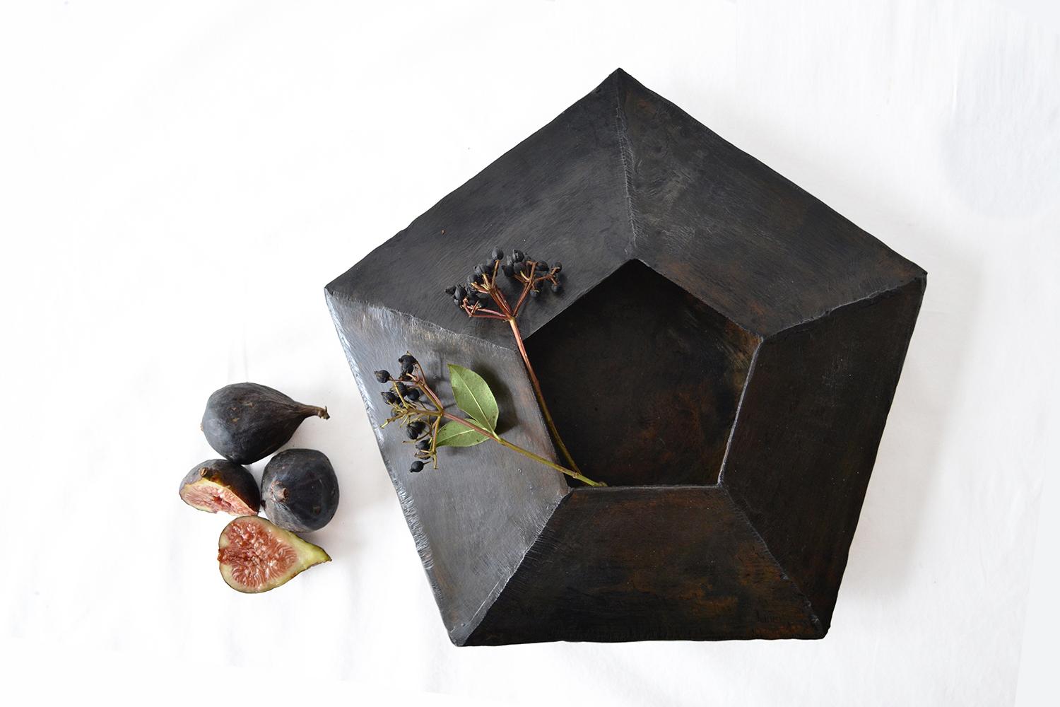 Vessel No. 5
J.M. Szymanski
d. 2017
Blackened and waxed iron

Mathematically designed and hand-wrought, this vessel uses 10-facets to help form this unique object that adds depth and design function to any space it is incorporated in.

Our products