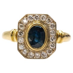 Geometric vinatge 18k gold ring with sapphire and diamonds.