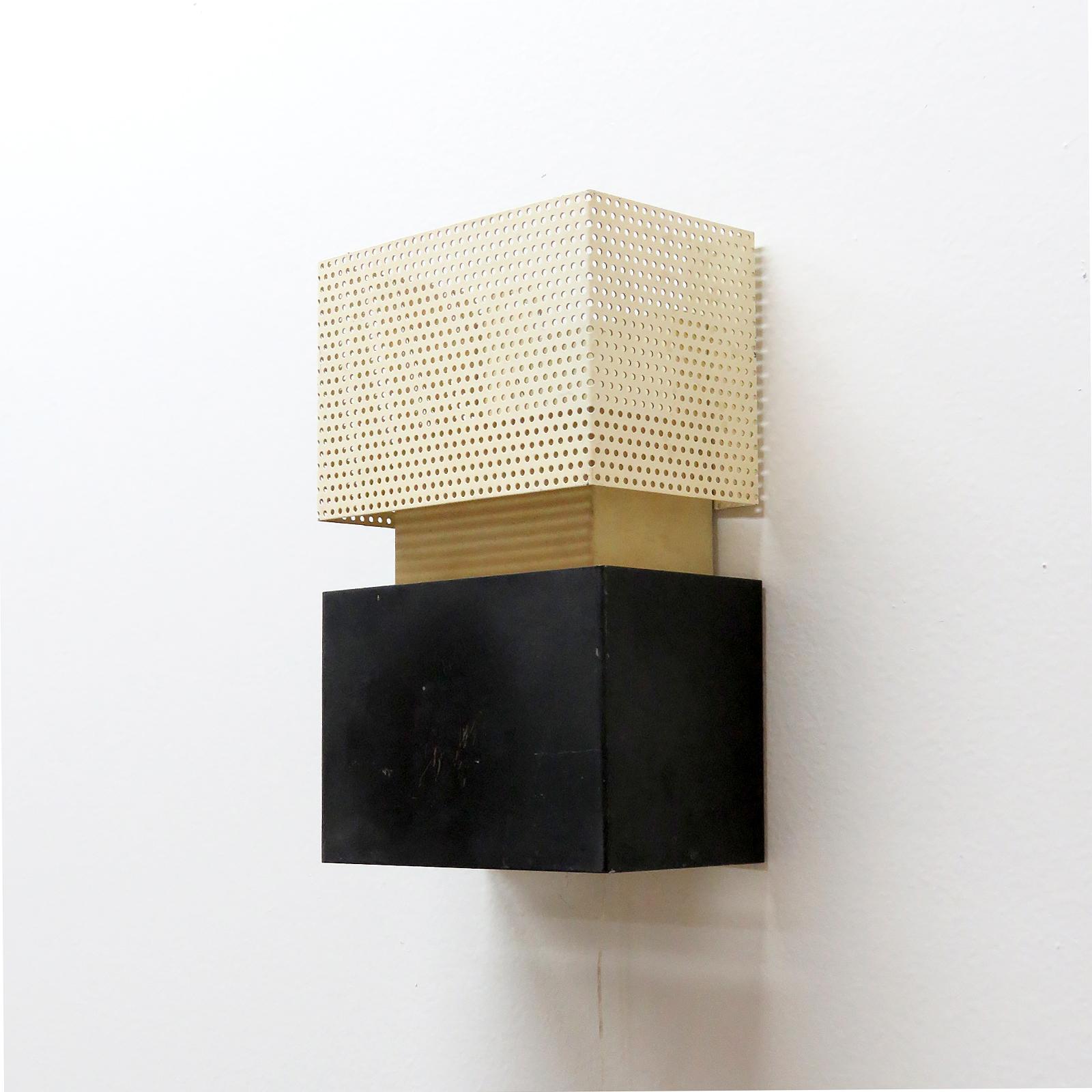 wonderful geometric wall lights by Jacques Biny,  black & creme colored enameled with perforations, wired for US standards, two E12 sockets, max. wattage 60w each or LED equivalent, with individual on/off pull switch, bulbs provided as a onetime