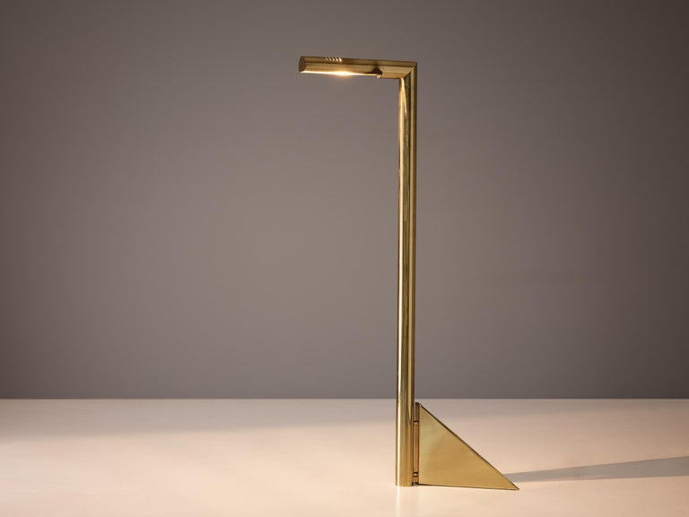 Floor lamp, brass, Europe, 1970s

Exquisite floor lamp with a solid appearance achieved using solely geometrical shapes. The cylindrical L-shaped stem is connected to a dimensional shaped triangle. The rotatable shade is adorned with five thin
