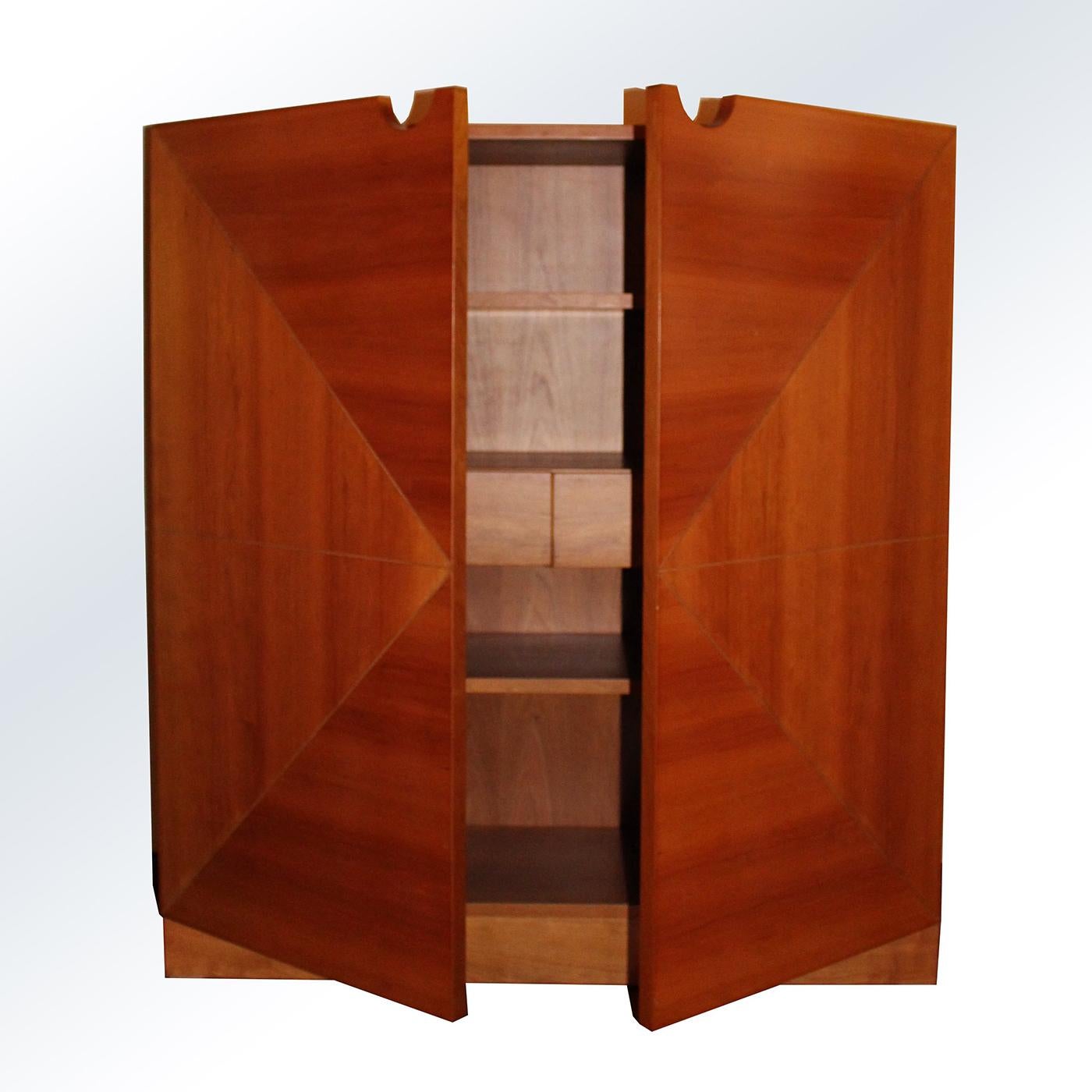 This stunning sideboard by Pietro Meccani is beautifully crafted from solid cherry wood. Its two doors feature a subtle geometric gradated design, showcasing the warm tones of the timber for a natural feel. The Geometrico Sideboard opens to reveal