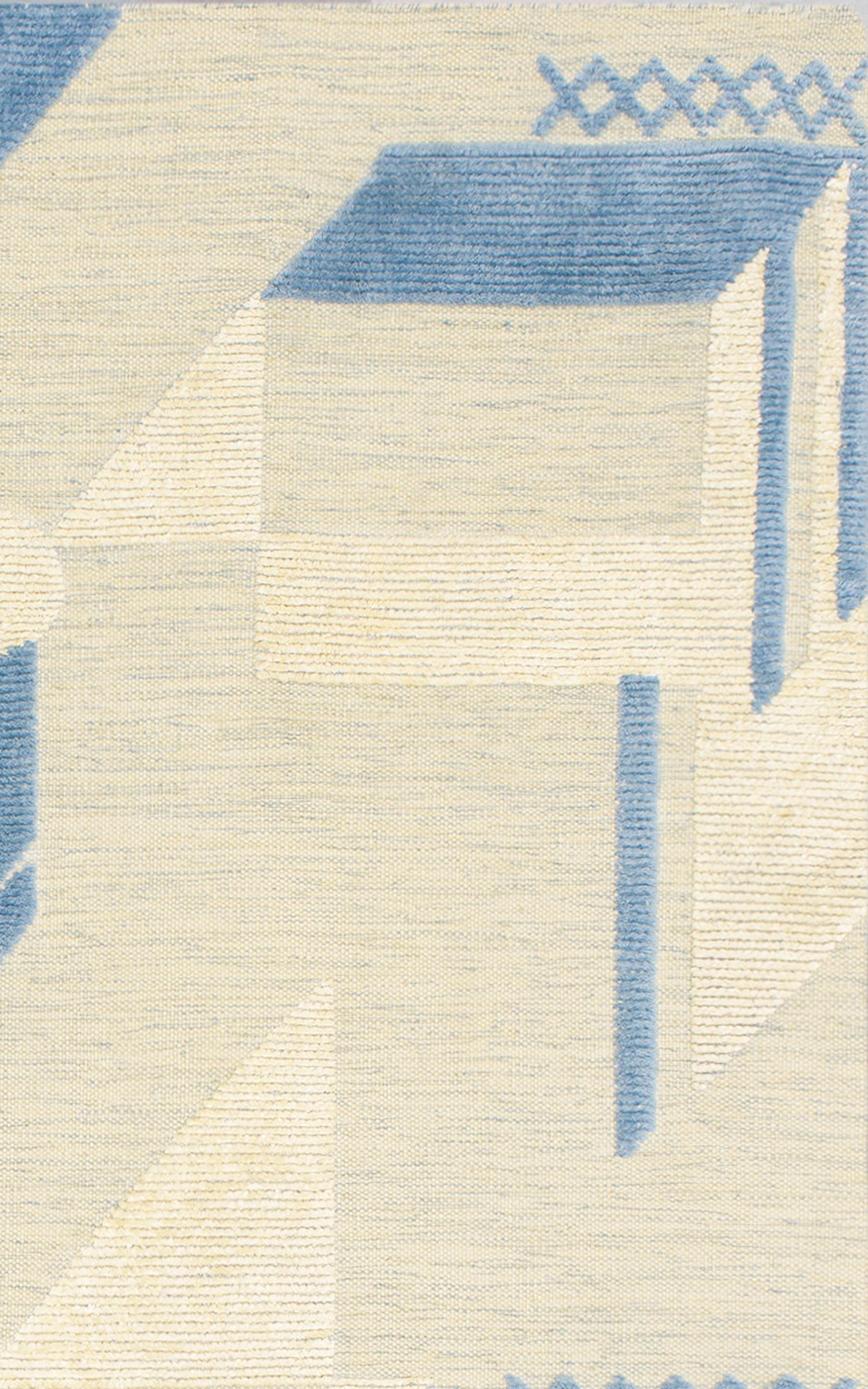 Part of new Knots Rugs Textures collection, Art Deco is a modern geometric flatweave design. Inspired by the Bauhaus movement, the raised silk shapes create a rich depth and textural interest to any space. Blue diagonal shapes sit on a warm cream