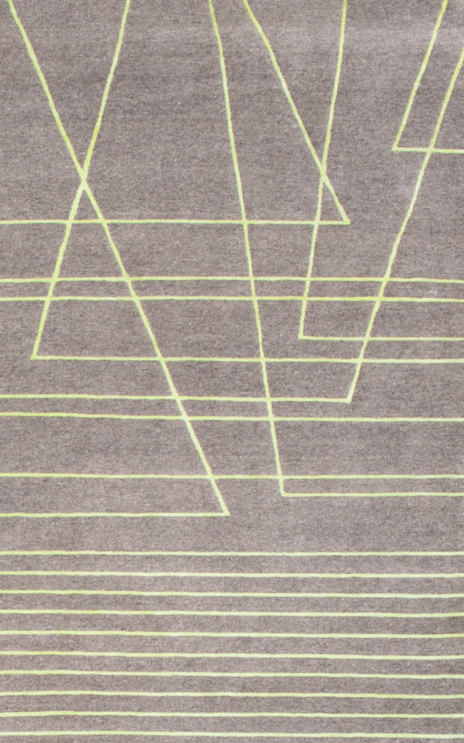 Broken Lines is a sophisticated hand-knotted rug which is hand-made in Nepal. This high/low minimalist geometric design uses the finest Tibetan wool and Chinese silk to form its acid green angular lines on a grey coloured ground. Bespoke colours and