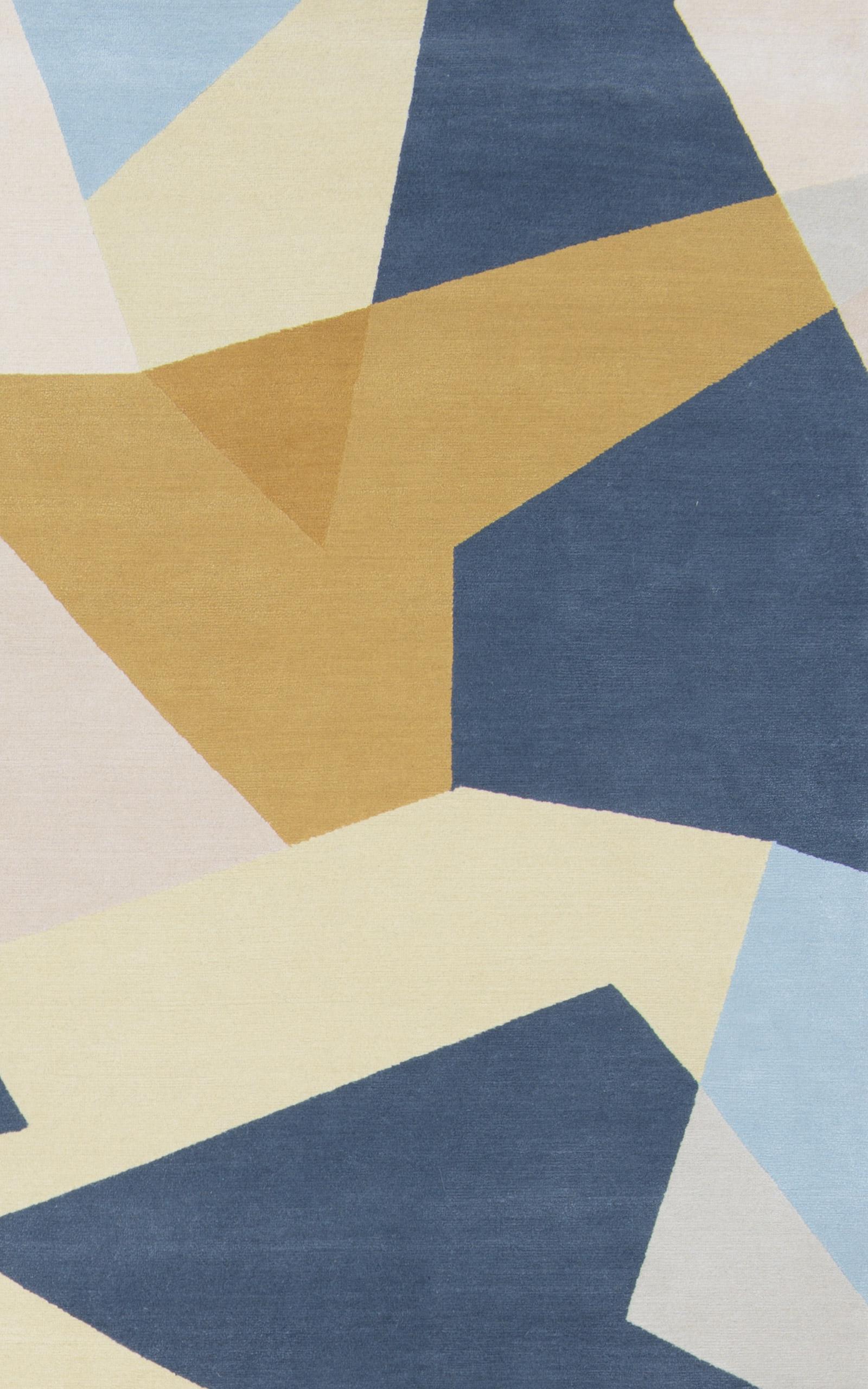 Patchwork is a modern geometric rug featuring a blue, beige and yellow colour block pattern made from a blend of wool and silk. Bespoke sizes and colourways are available upon request. 