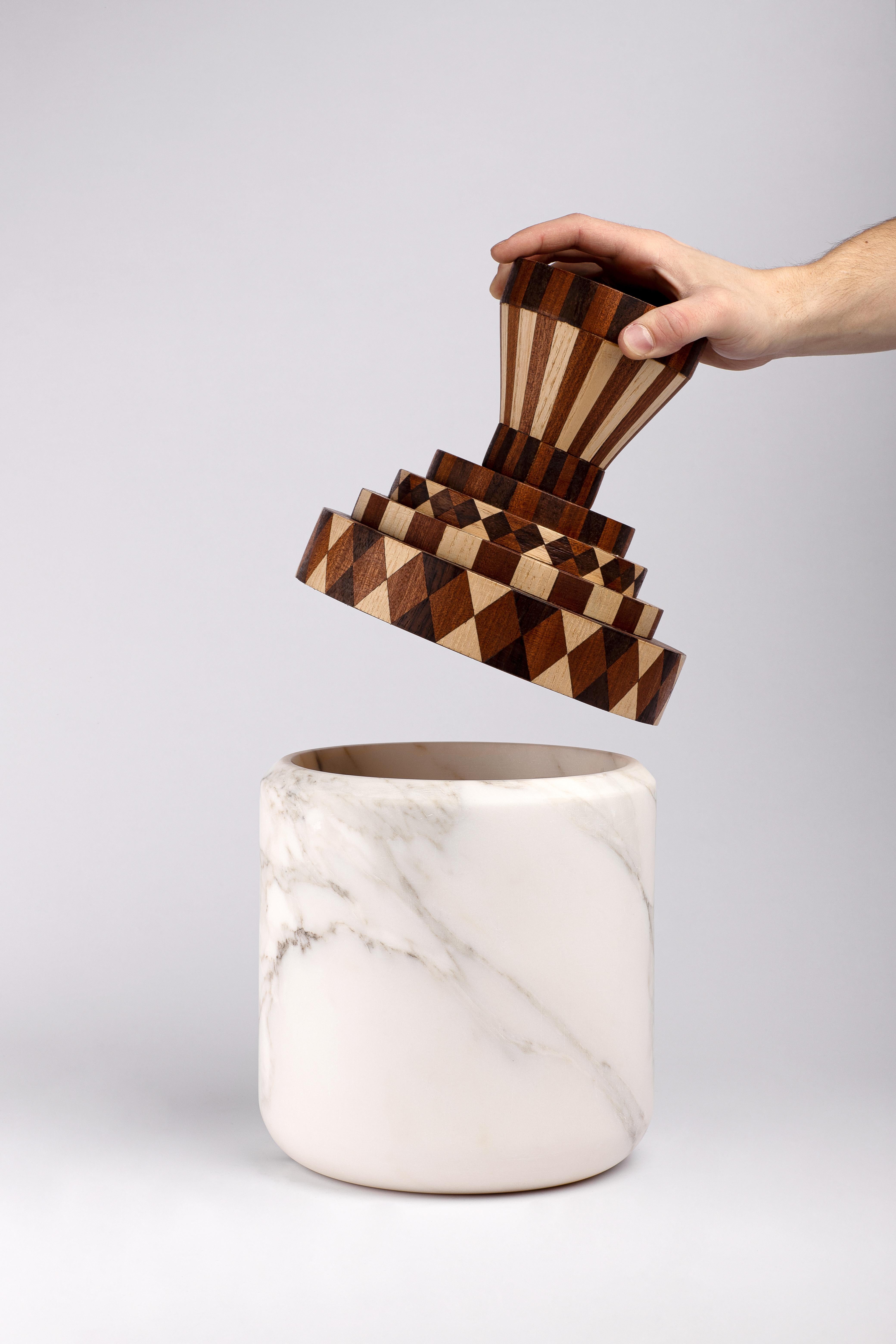 A collection made of Calacatta marble, worked on the manual lathe, and inlay in hand-made Cherry, Rosewood, Ash and Mahogany wood according to ancient traditions; two companies in the Neapolitan area that attribute production excellence, the search