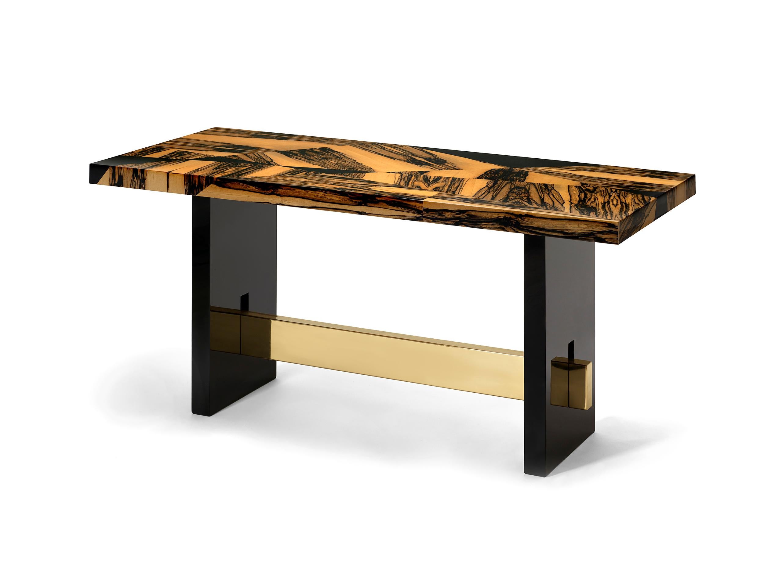 Geometry Console by DUISTT 
Dimensions: W 140 x D 40 x H 78 cm
Materials: White Ebony Marquetry Top, Black Lacquered and Brass

The geometry console uses the traditional marquetry technique in a contemporary design being a statement console that