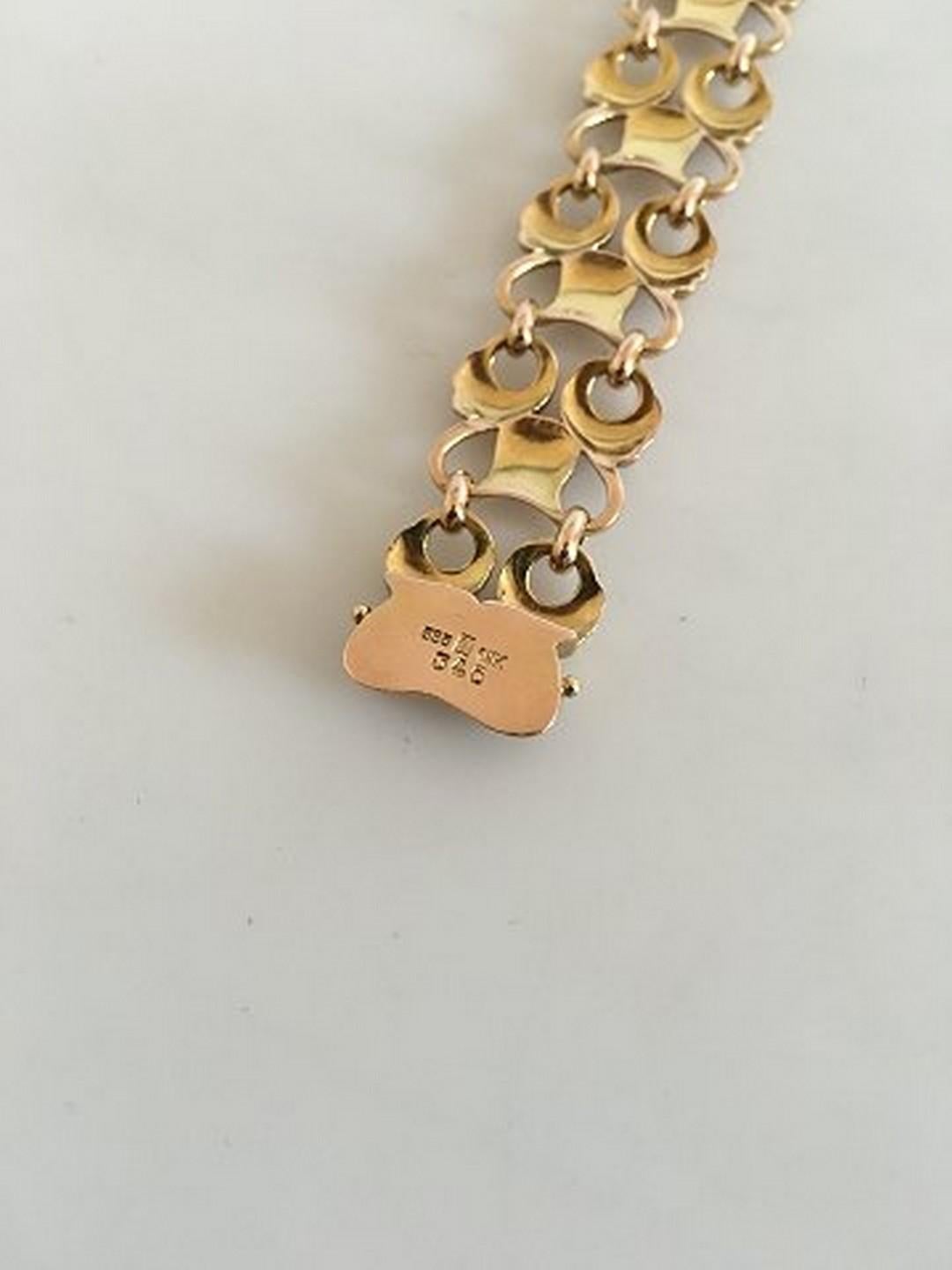 Georg Jensen 14K Gold Armband Nr. 346. Maße: 19 cm / 7 31/64 in. Wiegt 25 g / 0,90 Unzen. Von 1932-1945.