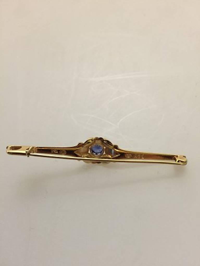 Art Nouveau Georg Jensen 18 Karat Gold Brooch with Synthetic Sapphire #281 For Sale