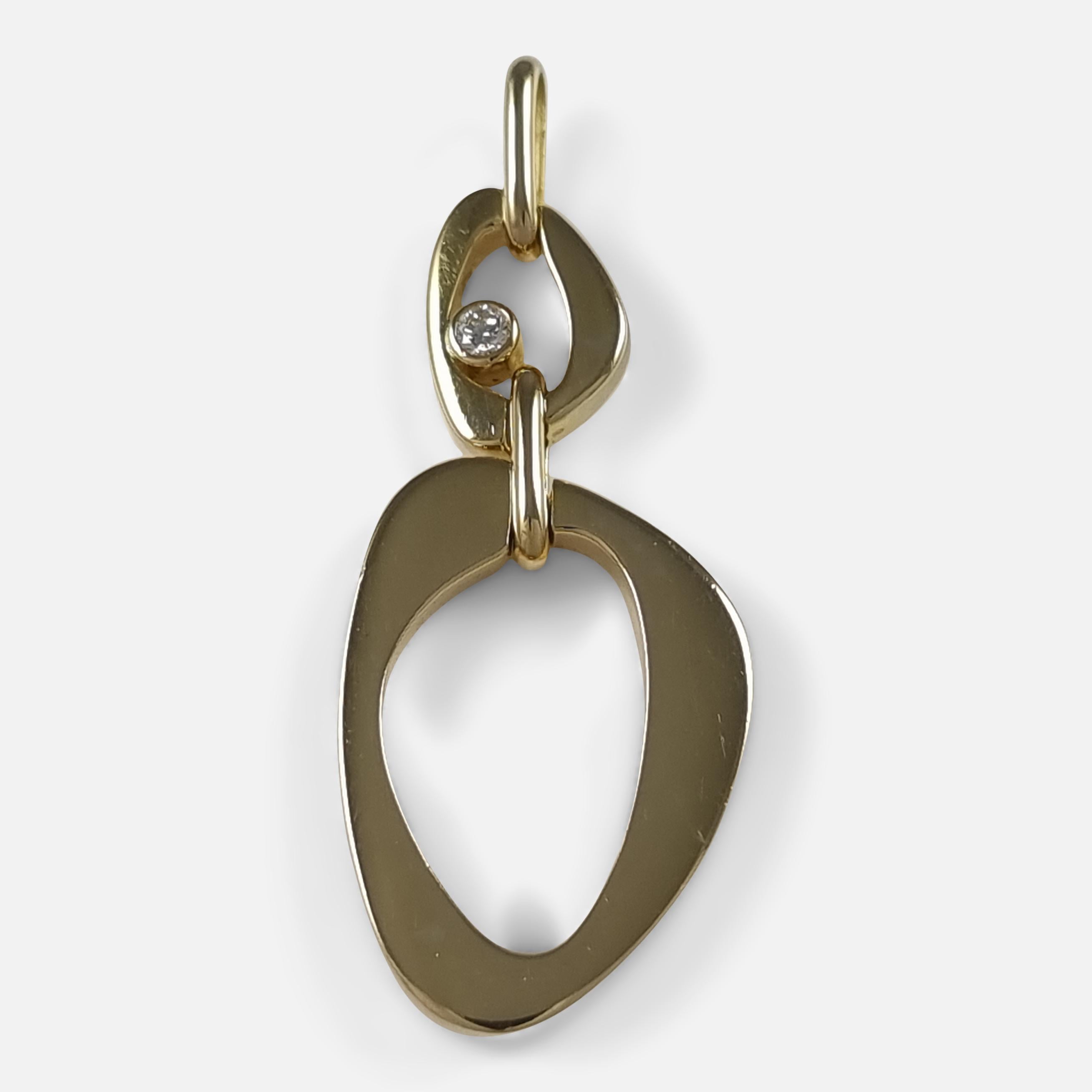 An 18ct yellow gold pendant by Lina Falkesgaard for Georg Jensen. Highlighted by its sleek design and subtle diamond embellishment, this piece bear the Georg Jensen makers marks.

 • Measurements: Pendant: 3.9cm (H including bale) x 1.5cm (W) x