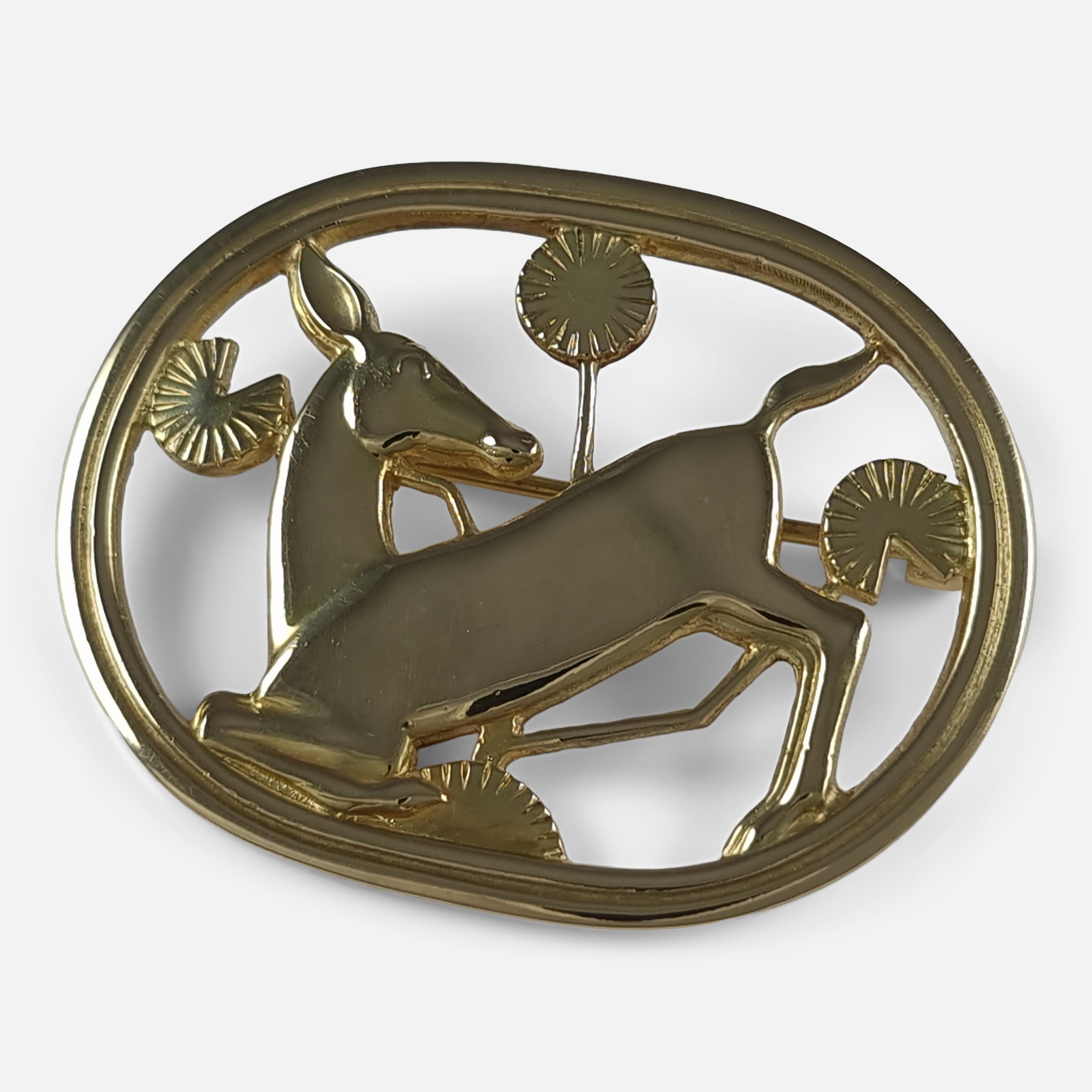 An 18ct yellow gold kneeling fawn brooch #343, designed by Arno Malinowski for Georg Jensen.

The brooch is stamped with the Georg Jensen mark used since 1945, '18K', '765', & '343'. Also hallmarked with Edinburgh assay marks, and 