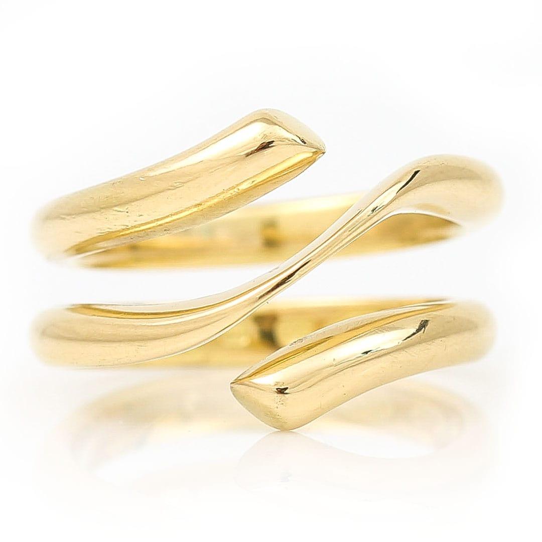 A wonderful pre-loved 18ct yellow gold Magic ring from the renowned Scandinavian design house of Georg Jensen designed by Regitz Overgaard. The ring comprises two parts - the outer part is being sold in this listing - a band of plain polished 18ct