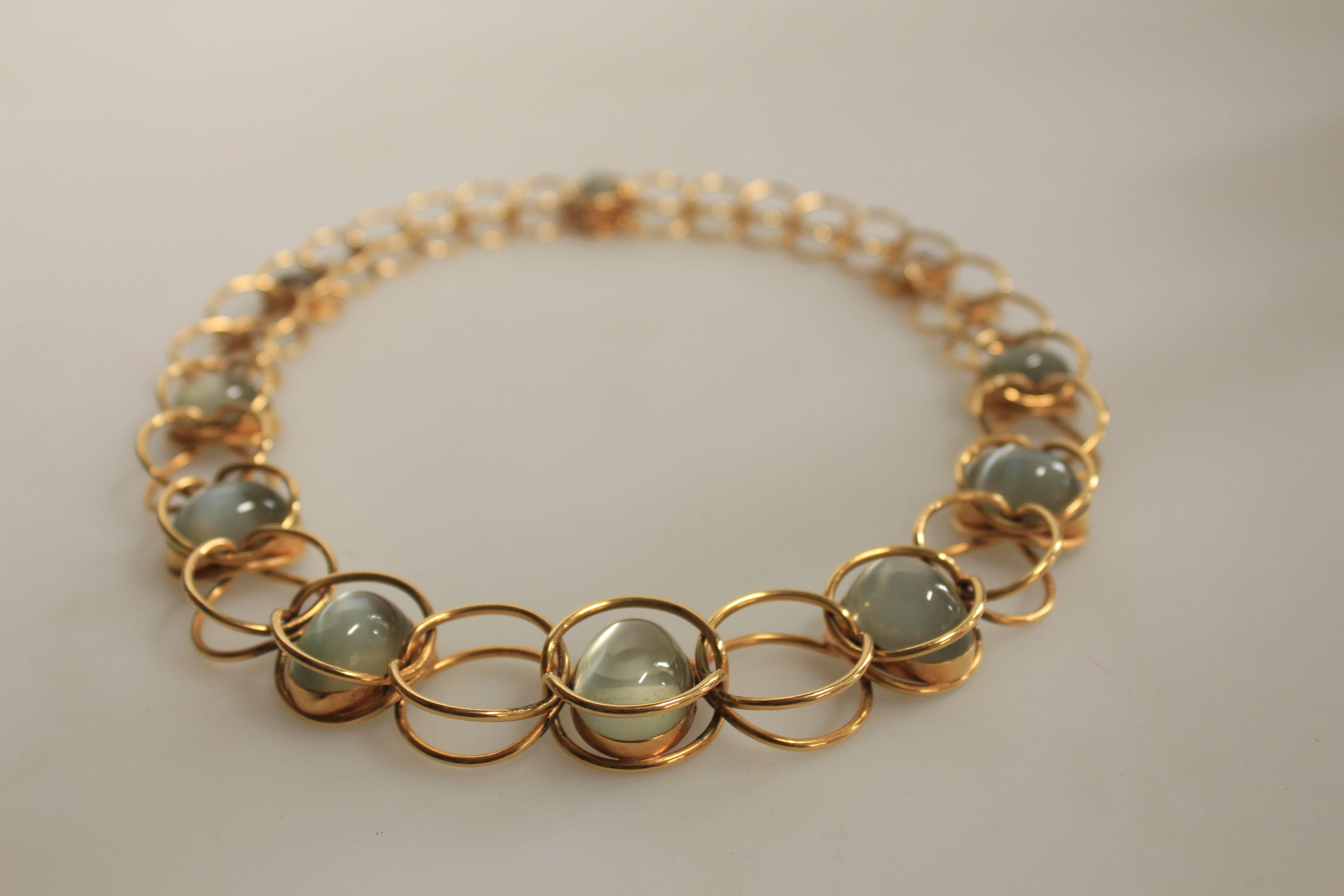 Set of: 
Necklace Design # 806
Bracelet Design  #1161A
18K gold and moonstones
Ca 1970’
Necklace Marked : with post 1945 stamps (GEORG JENSEN in dotted oval) - British import control marks
