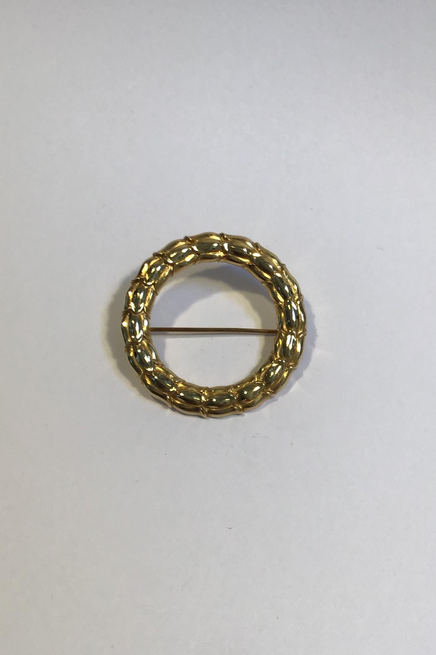 Georg Jensen 18K Gold Brooch No 360 Sigvard Bernadotte 

Measures 3.6 cm(1 27/64 in)
Weight 7.4 gr/0.26 oz