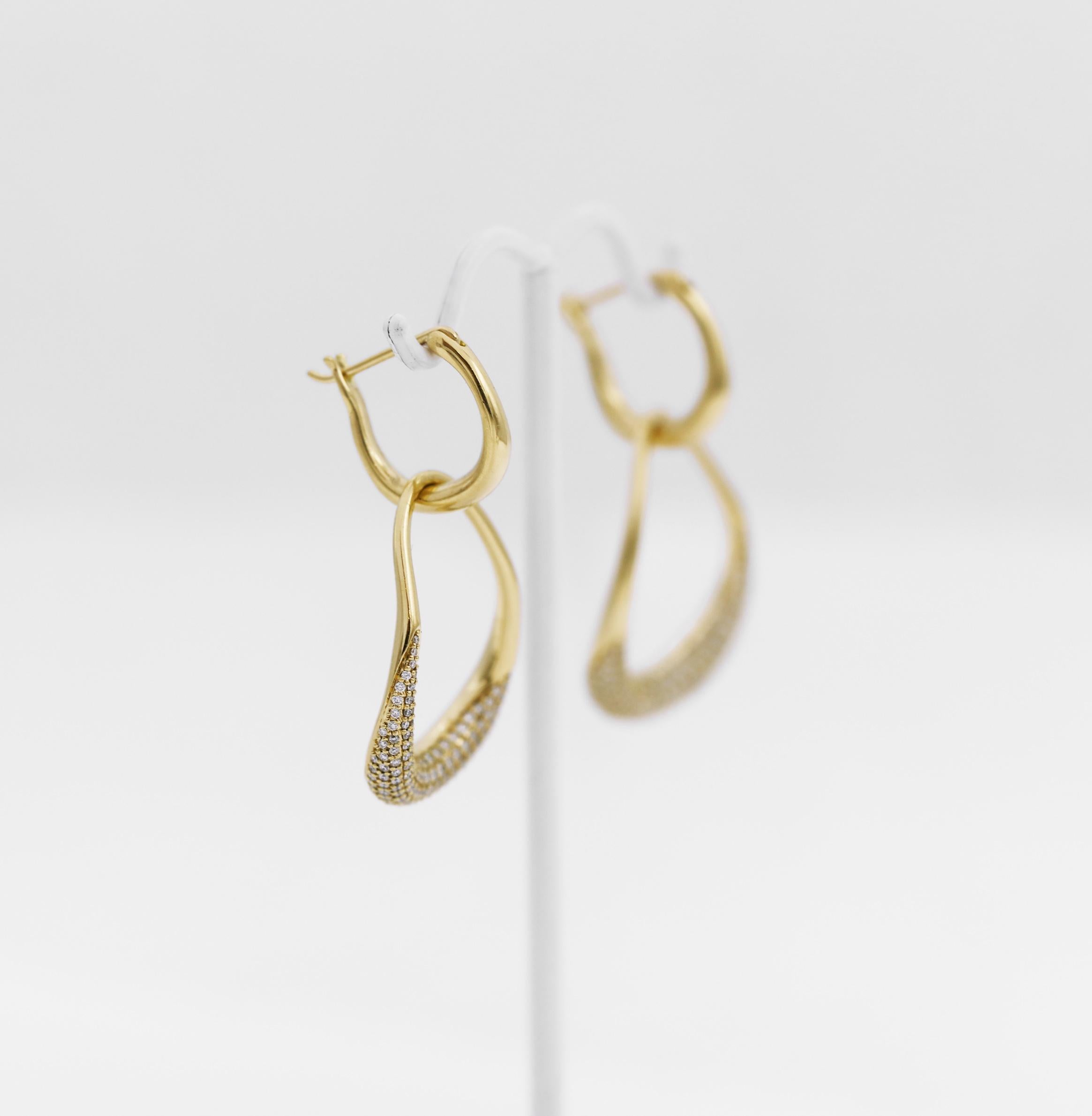 GEORG JENSEN 
These Offspring earrings tell the fantastic story of the unbreakable bond between mother and child.
Two exquisite rings are interlocked, the large ring protecting the small one, in a timeless and emotional tribute to the strength of a