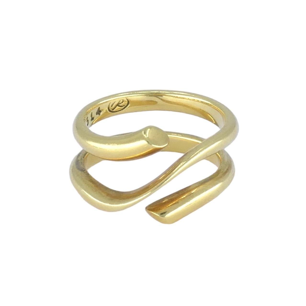 1970s Georg Jensen 18k Gold Ring. This ring features a removable rubber band in the middle of the two bands that connect in the front along a diagonal. Weighing 9.1 grams, the ring is a size 7 and features clean, elegant lines. The ring measures 1