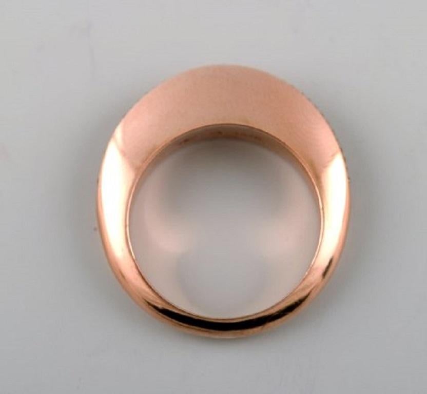 Georg Jensen, Dune ring in 18 carat rose gold with brilliant-cut diamonds, approx. 0.13 ct. 
Color: Light brown. Clarity. VS. 
Design number 1570. 
Ring size. 58. Diameter 18.25 mm. US size 8. Our goldsmith can adjust to any size for an additional