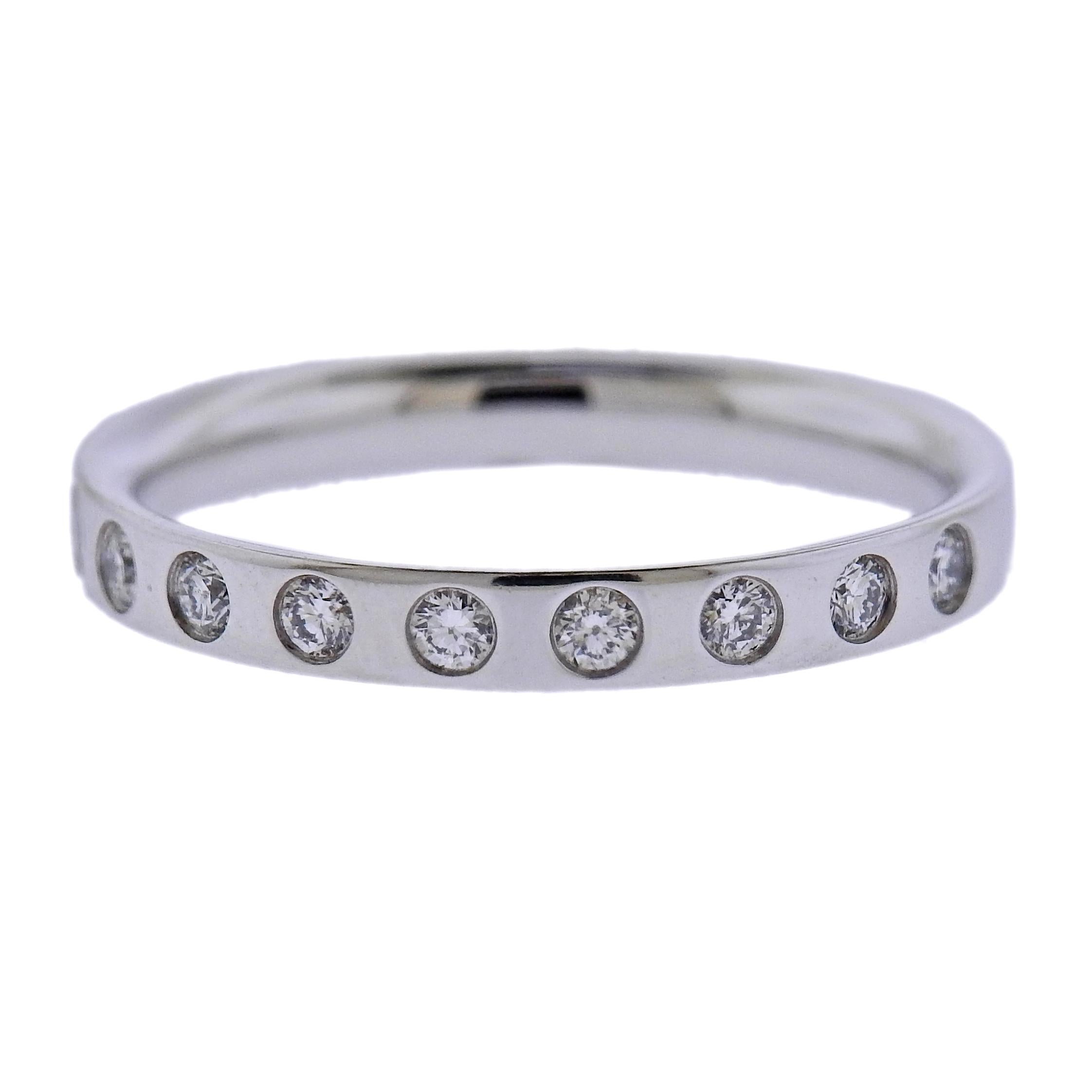 Brand new Georg Jensen 18K white gold band ring set with approx. 0.18ctw of G/VS diamonds. Ring measures 3mm wide and available in following sizes: 51,53,54. Model#3569900. Marked: GJ, 750, ring size, 1515 B. Weight is 2.7 grams.