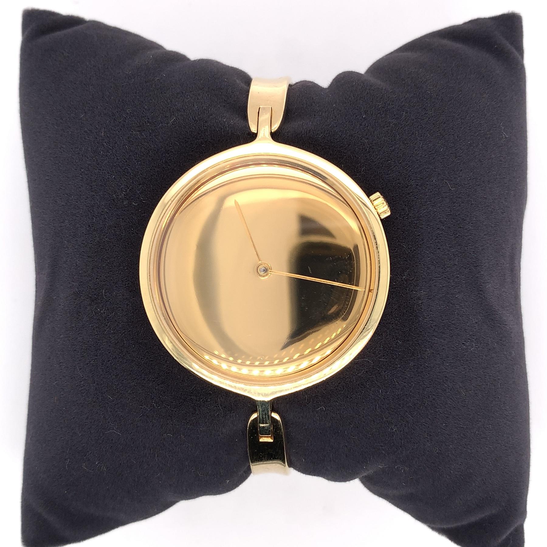 18K yellow gold Georg Jensen bangle watch #1227 designed by Vivianna Torun. The watch weighs 38.55dwt. The top with face is 1 3/8