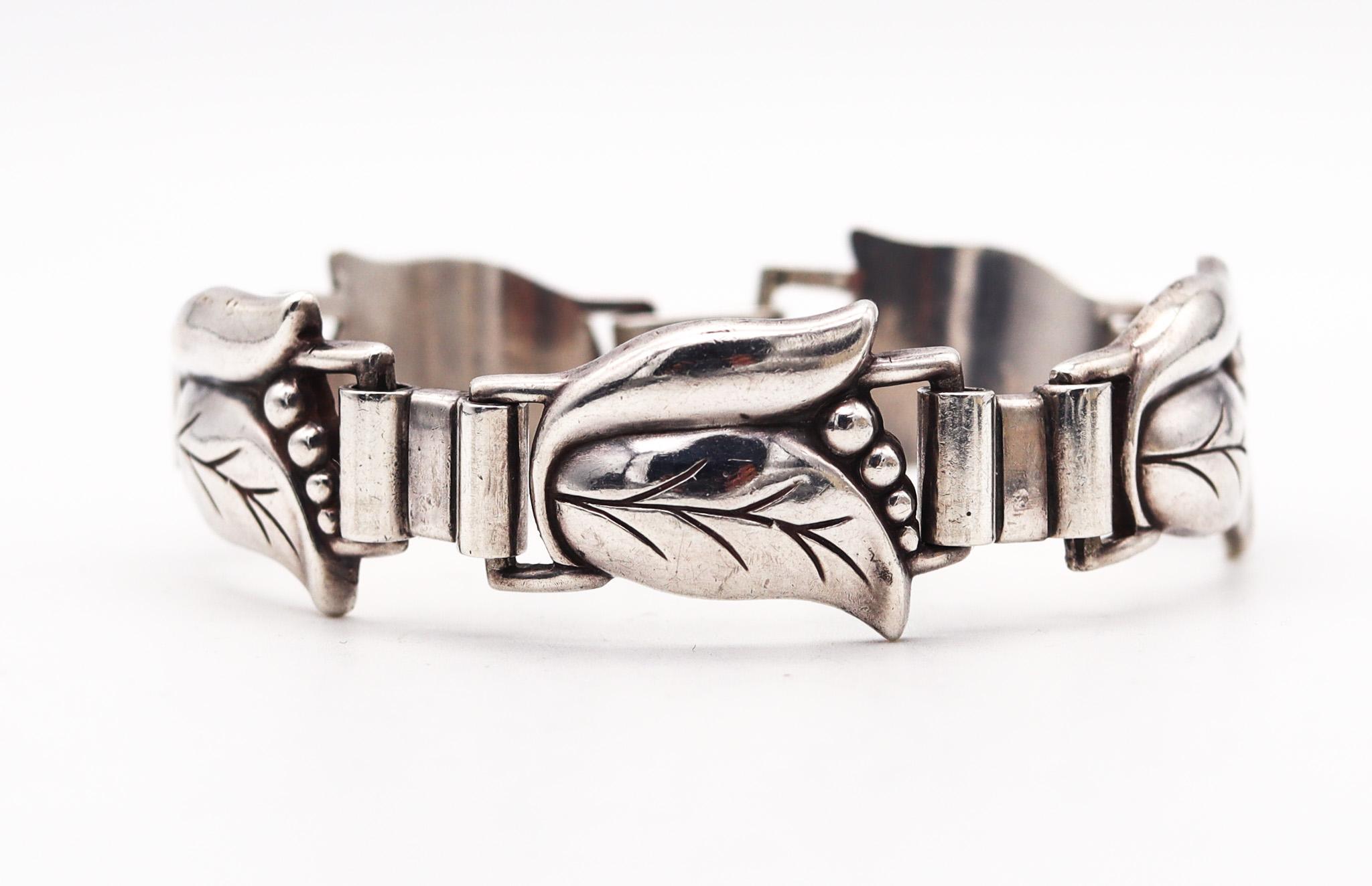 Art deco bracelet designed by Alphonse La Paglia for Georg Jensen.

This is a beautiful bracelet, created by the silversmith and designer Alphonse La Paglia for the Georg Jensen company, back in the 1940. This bracelet has been crafted in the art