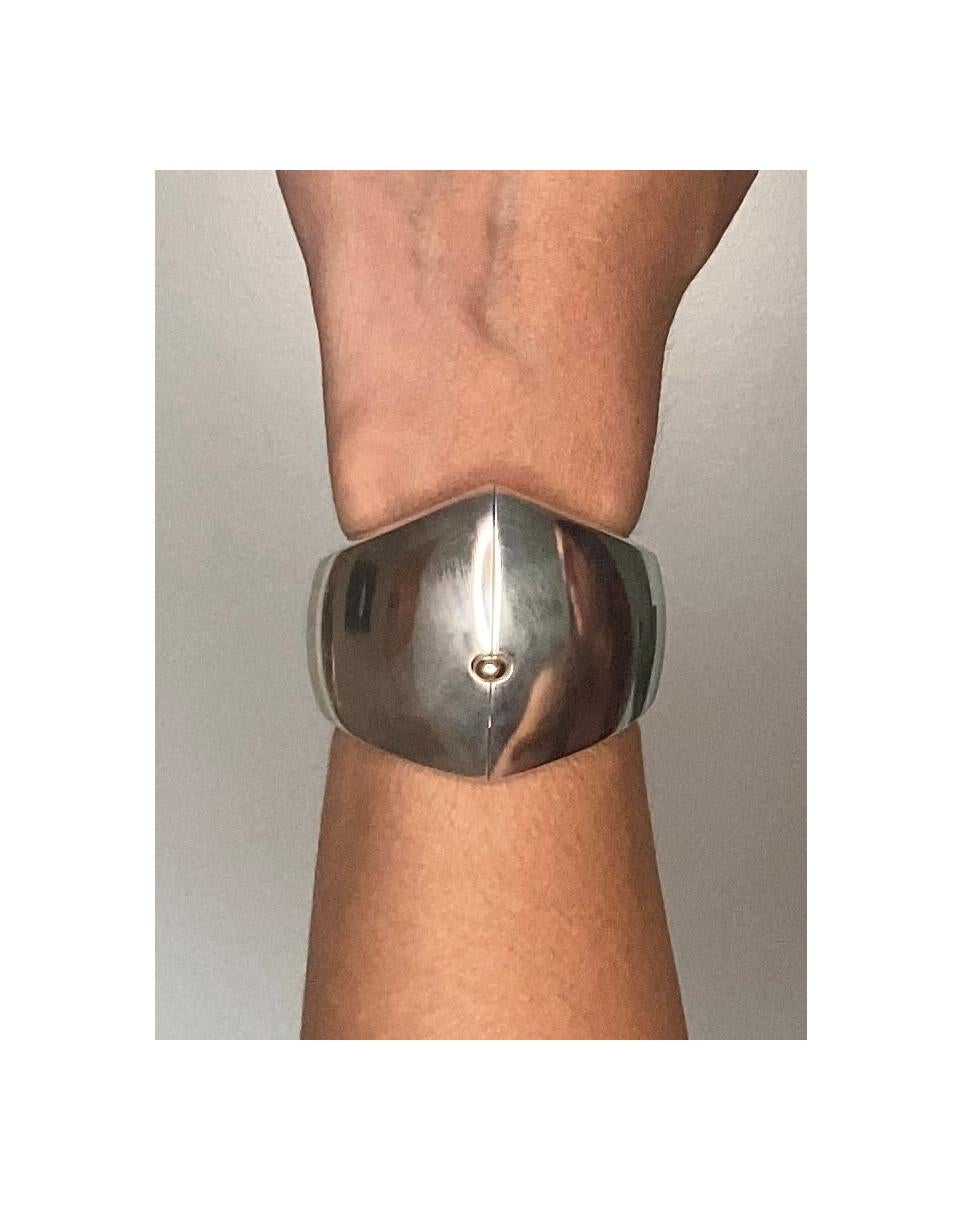 Bangle cuff designed by Nanna and Jørgen Ditzel for Georg Jensen.

This bracelet is categorized as one of the most iconic modern designs from the 20th century. Created in Denmark by Nanna and Jørgen Ditzel for the Georg Jensen company back in the