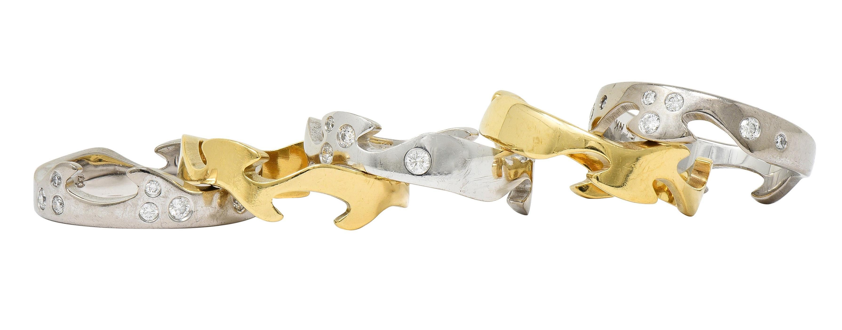 Comprised of five fitted band rings featuring puzzle prongs and slots
With undulating wave contour and alternating with gold color
Flush set with round brilliant cut diamonds throughout
Weighing approximately 0.55 carat total
G/H color with VS2