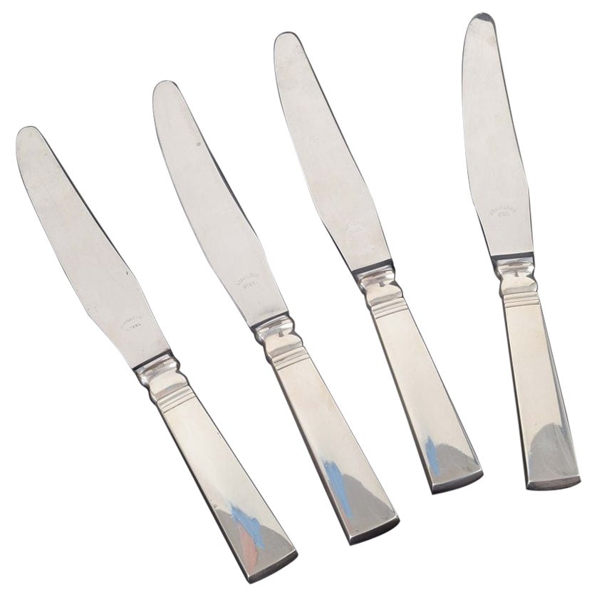 Georg Jensen. 4 dinner knives in sterling silver and stainless steel.