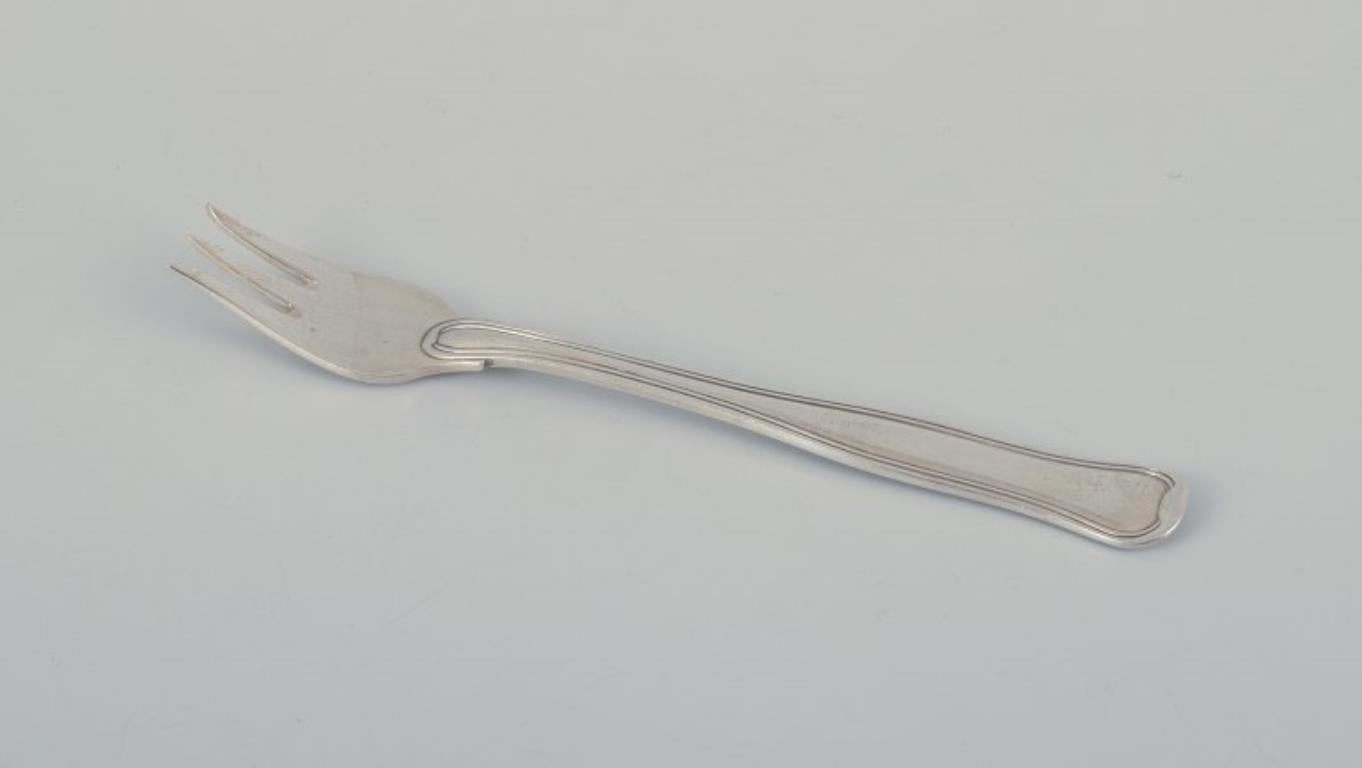 Georg Jensen. Un set di otto forchette da pasticceria 