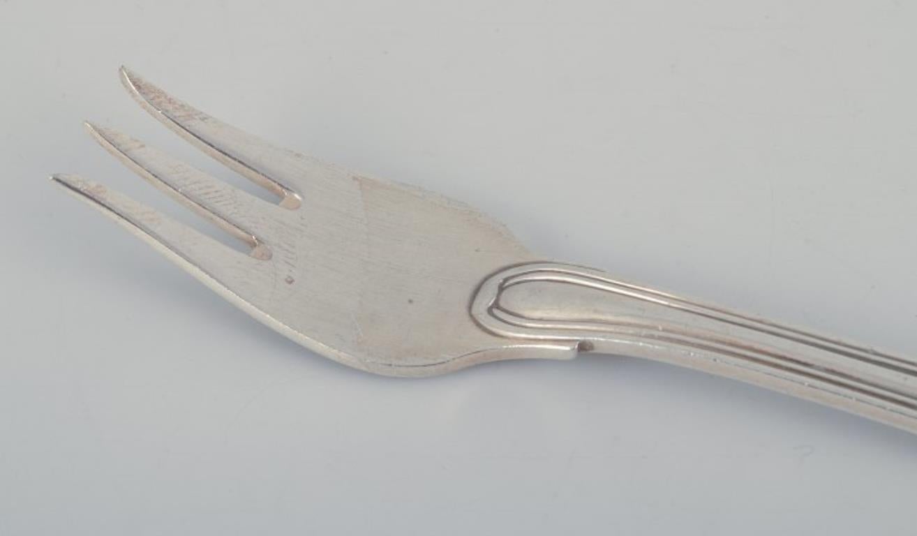 Danese Georg Jensen. Un set di otto forchette da pasticceria 