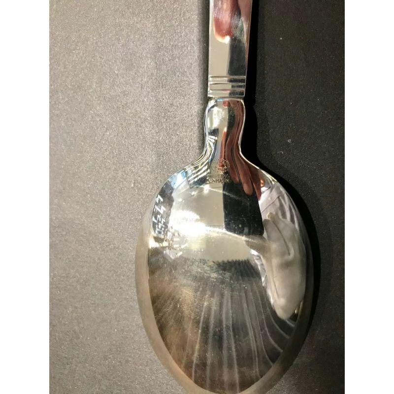 Sterling silver Georg Jensen large dinner spoon, item 001 in the Acadia pattern, design #46 by Ib Just Andersen from 1934.

Additional information:
Material: Sterling silver
Styles: Art Deco
Hallmarks: Post 1944 Georg Jensen hallmark.
Dimensions: