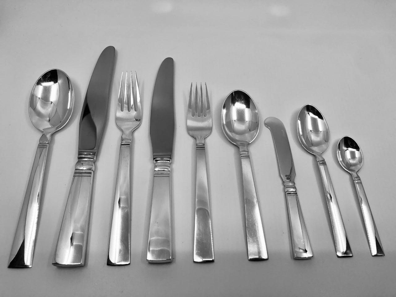This is a Georg Jensen sterling silverware service in the Acadia pattern, design #46 by Ib Just Andersen from 1934.
This service includes 10 settings of 9 pieces. Note the dinner pieces are the extra large 