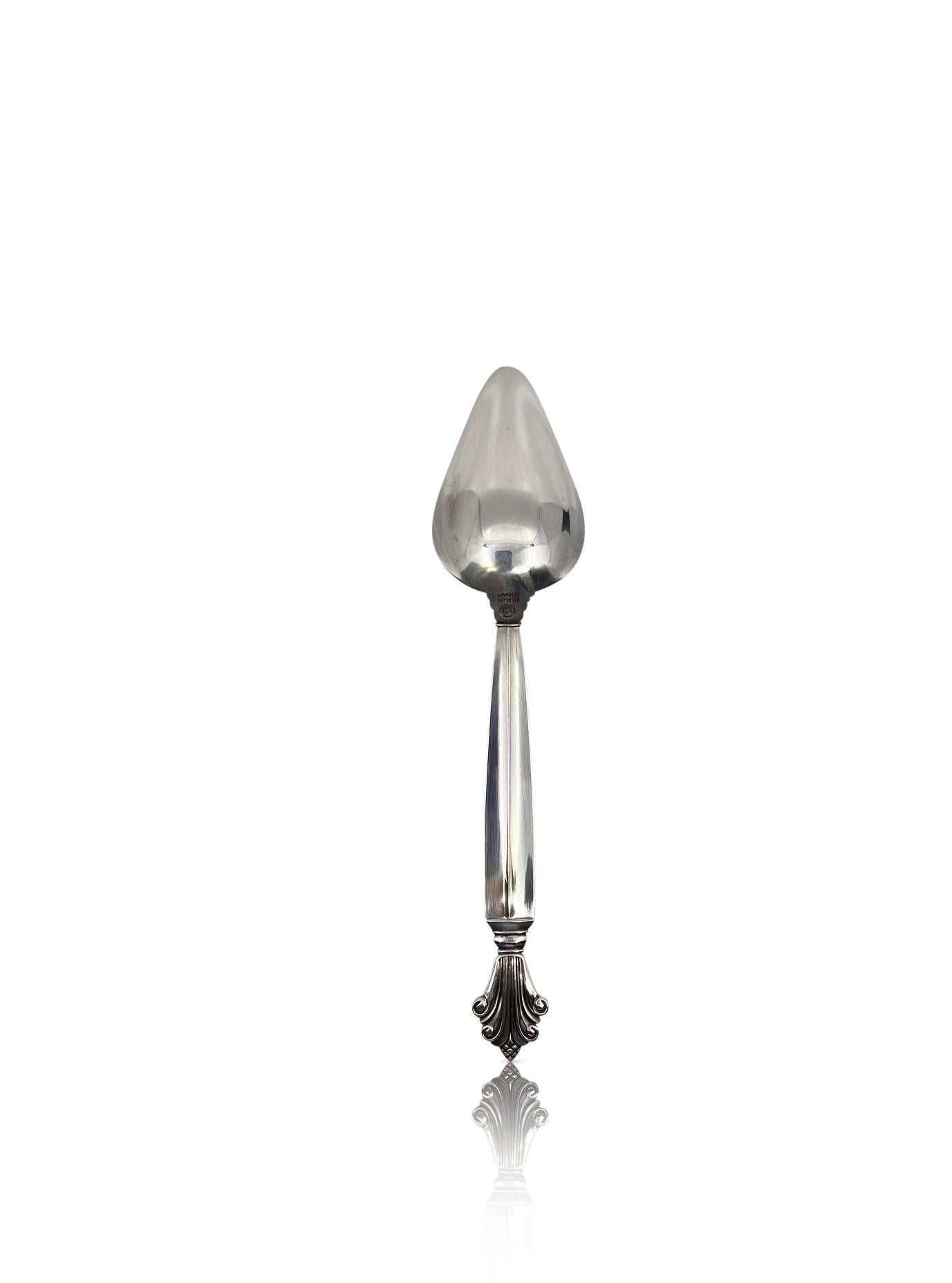 Georg Jensen sterling silver grapefruit spoon, item #075 in the Acanthus pattern, flatware design #180 by Johan Rohde from 1917.

Additional information:
Material: Sterling silver
Styles: Art Nouveau
Hallmarks: With Georg Jensen hallmark, made in