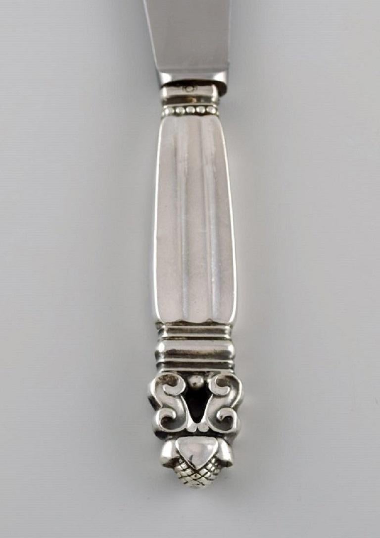 Georg Jensen Acorn lunch knife in sterling silver and stainless steel. 
Measure: Length: 20.5 cm.
Stamped. 
In excellent condition.
Our skilled Georg Jensen silversmith / goldsmith can polish all silver and gold so that it appears new. The price