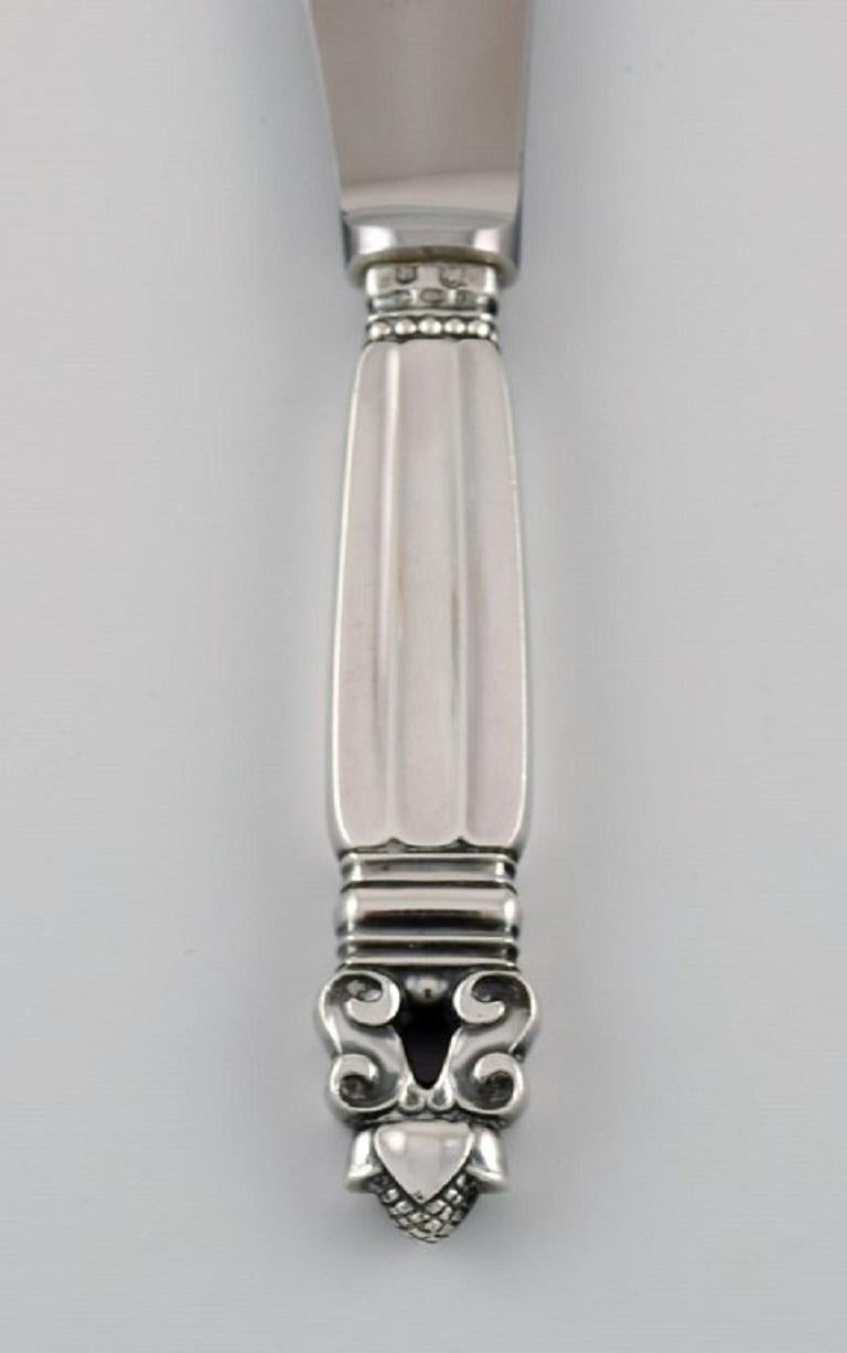 Georg Jensen Acorn lunch knife in sterling silver and stainless steel. 
Six knives are available.
Measure: Length: 20.5 cm.
Stamped. Different stamps.
In excellent condition.
Our skilled Georg Jensen silversmith / goldsmith can polish all