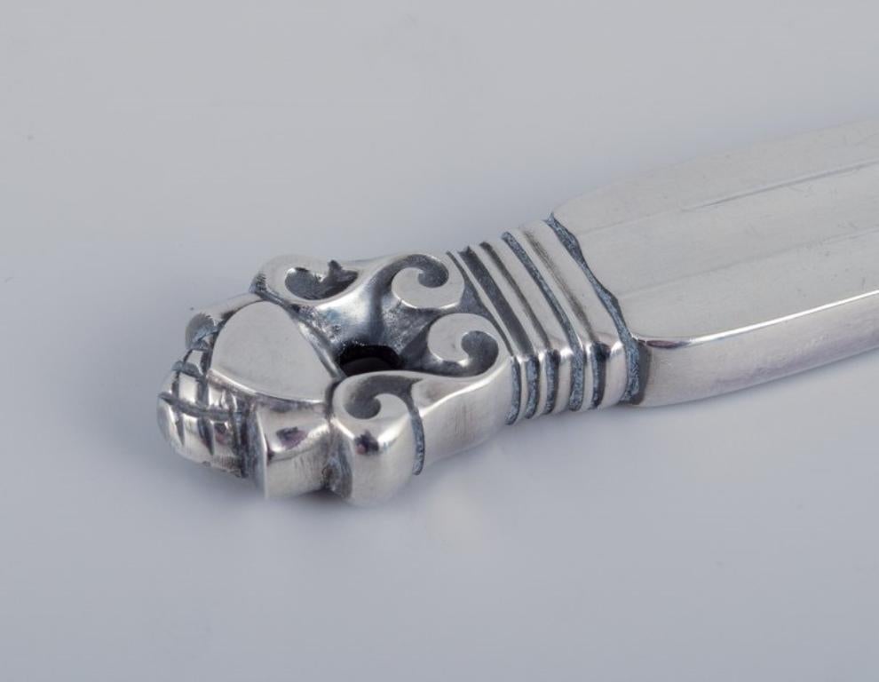 XX secolo Georg Jensen Acorn, sette coltelli da burro in argento sterling, tutti in argento. in vendita