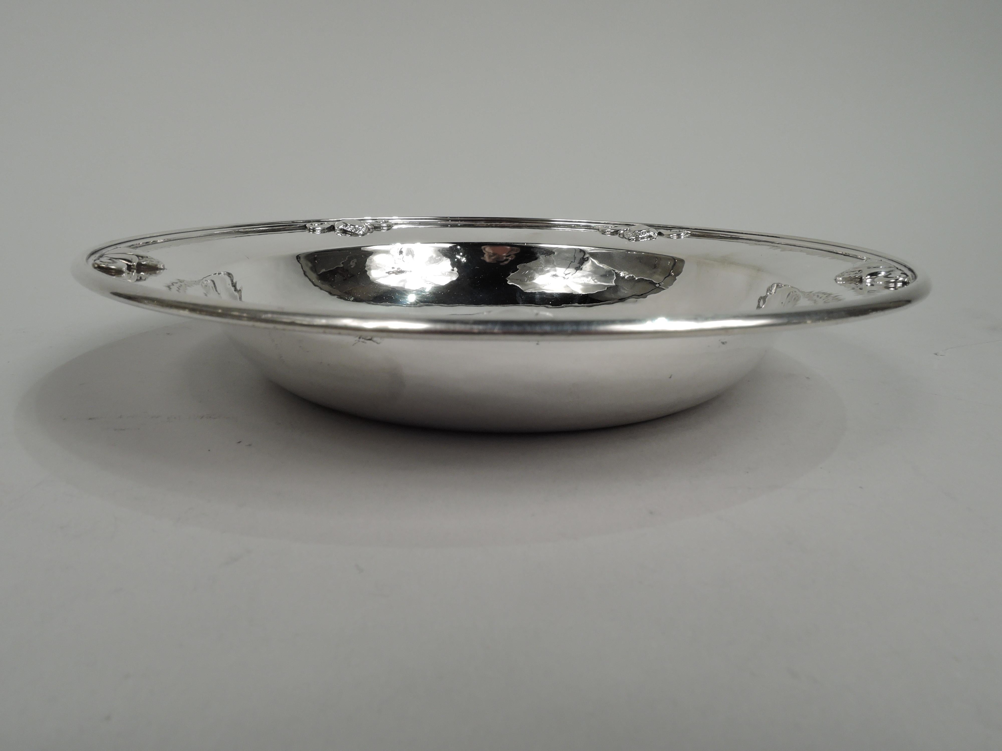 Acorn sterling silver bowl. Made by Georg Jensen in Copenhagen. Round well, curved and tapering sides, and wide hand-hammered shoulder applied with stylized acorns. Fully marked including maker’s stamp (1945-77) and no. 642. Weight: 7 troy ounces.