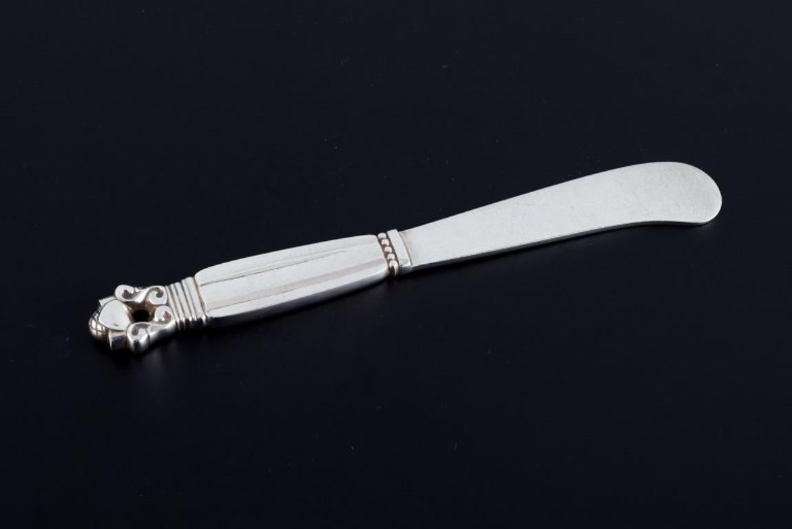Georg Jensen, Acorn, two butter knives in sterling silver.
Marked post 1945.
In excellent condition.
Measurements: L 14.8 cm.