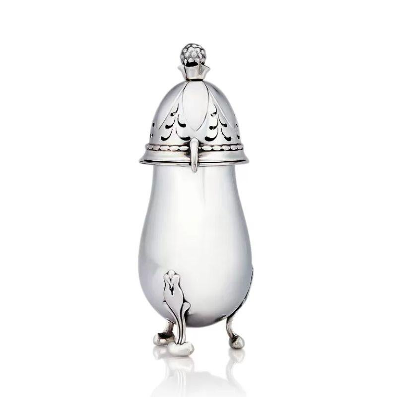 A Georg Jensen silver art nouveau sugar caster, design #69, designed by Georg Jensen in 1915. This captivating piece showcases the impeccable craftsmanship for which Jensen is renowned and represents a true testament to the elegance of the art