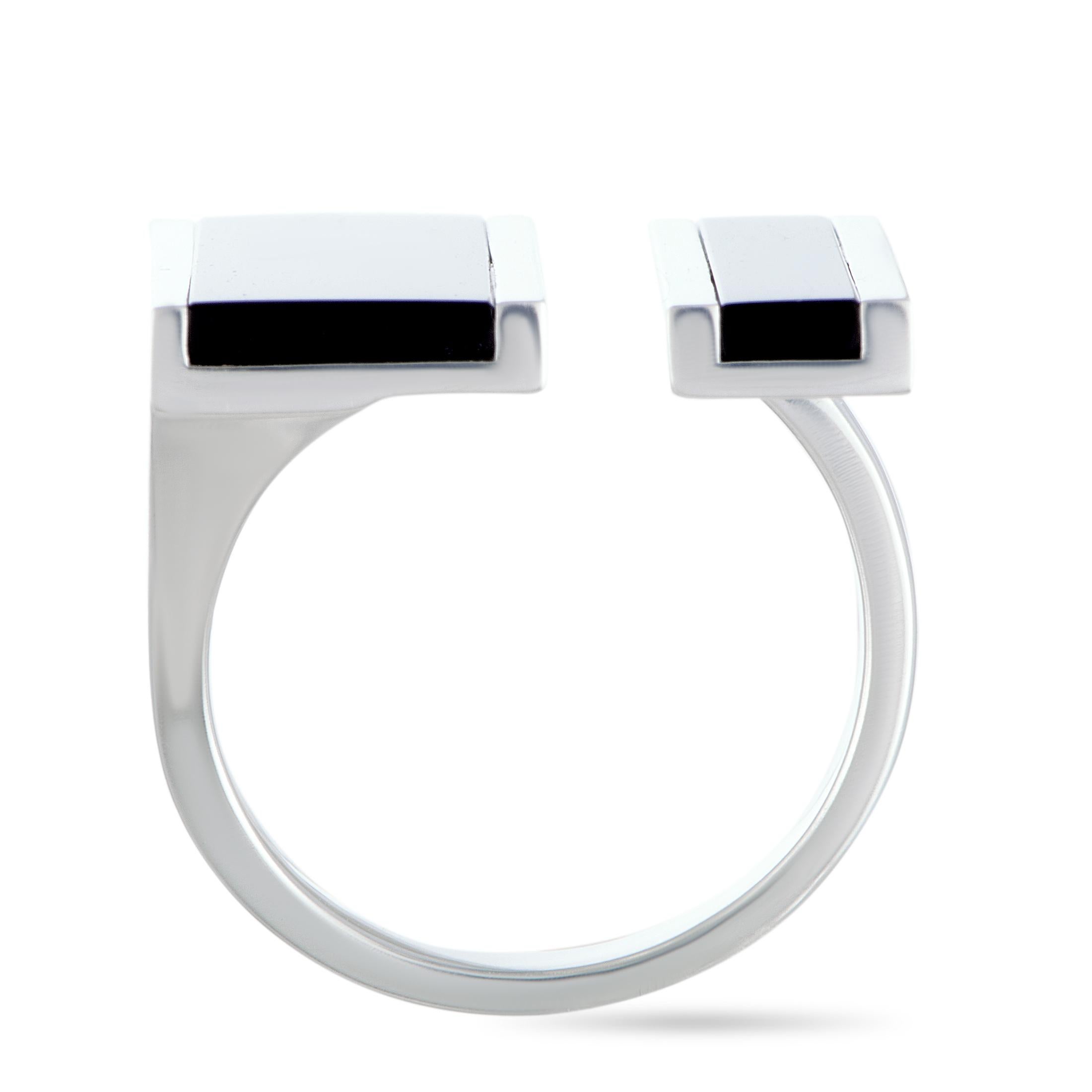 The Georg Jensen “Aria” ring is crafted from silver and set with two onyx stones. It weighs 10.5 grams, boasting band thickness of 3 mm and top height of 2 mm, while top dimensions measure 24 by 24 mm.

This piece is offered in brand new condition