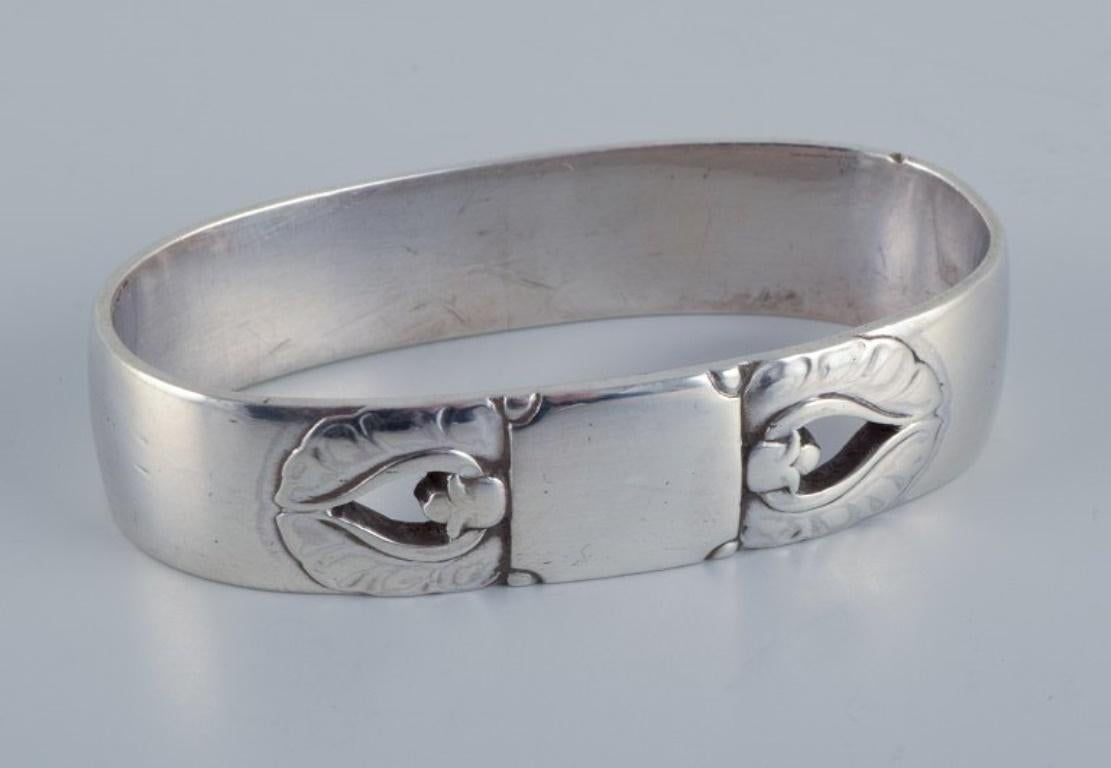 Georg Jensen, Art Deco napkin ring in sterling silver. 
Model number: 238A. 
1933-1944 hallmark. 
Perfect condition. 
Dimensions: L 5.2 cm x W 2.7 cm.