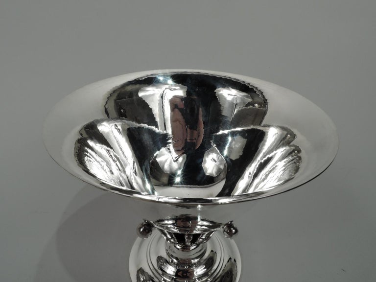 Art Nouveau sterling silver bowl. Made by Georg Jensen in Copenhagen. Round and tapering with flared rim set in open tendril support on round and stepped foot. Hand hammered with nice shimmer. This design illustrated in: Drucker, Georg Jensen, 1997,