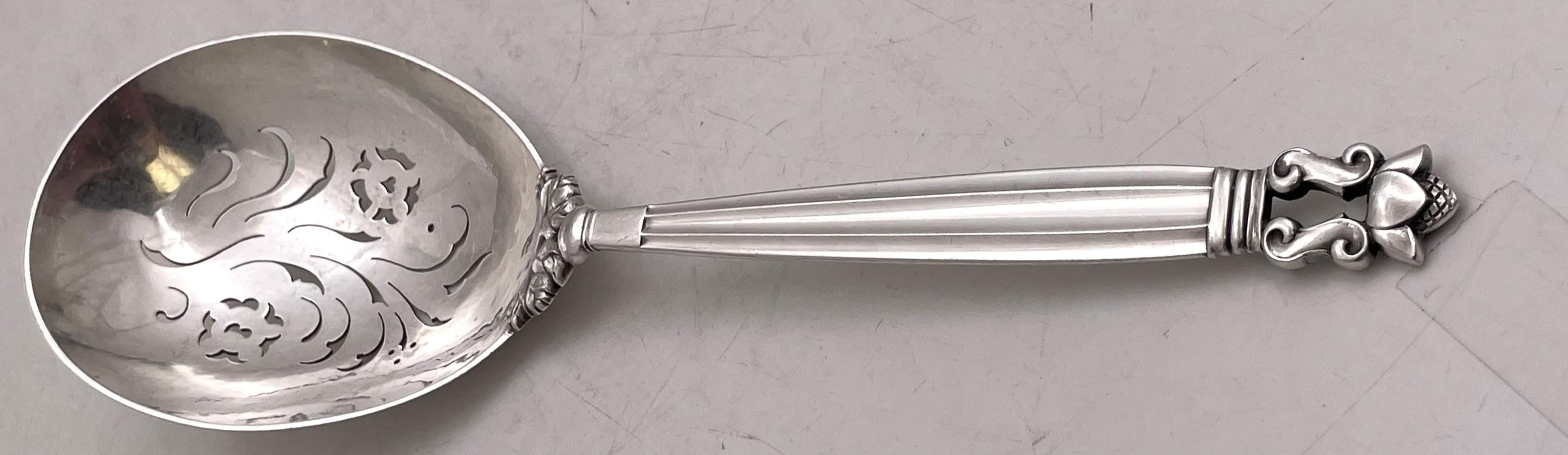 Georg Jensen assorted sterling silver servers in the Acorn pattern, consisting of:

a pierced serving spoon measuring 10 1/2'' in length (oversize)

a two-piece salad set (fork and spoon) measuring 8 3/4'' in length

a pie knife measuring 10 1/2''