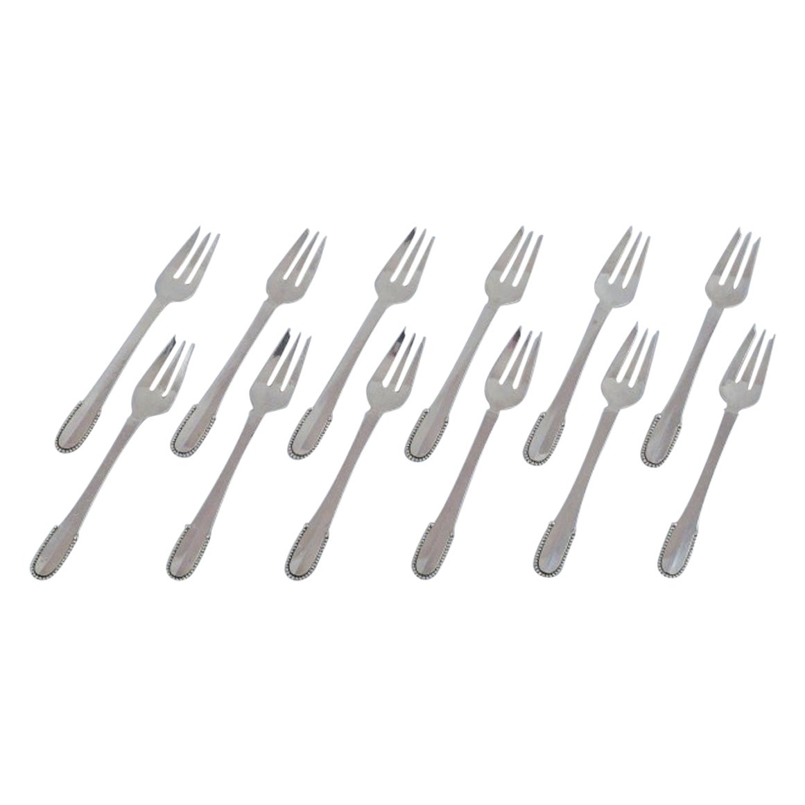Georg Jensen Perlen. Set von zwölf Kuchengabeln aus Sterlingsilber.