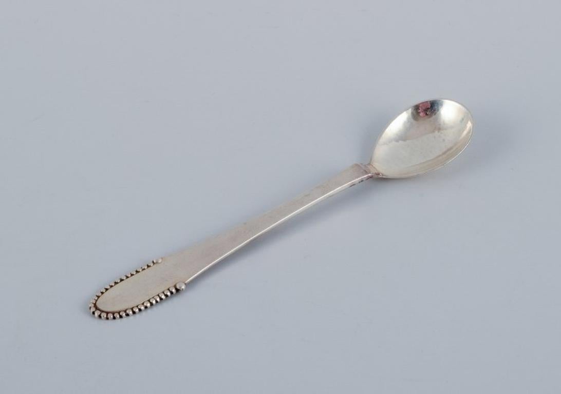 Danish Georg Jensen Beaded. Set of twelve coffee spoons in sterling silver. For Sale