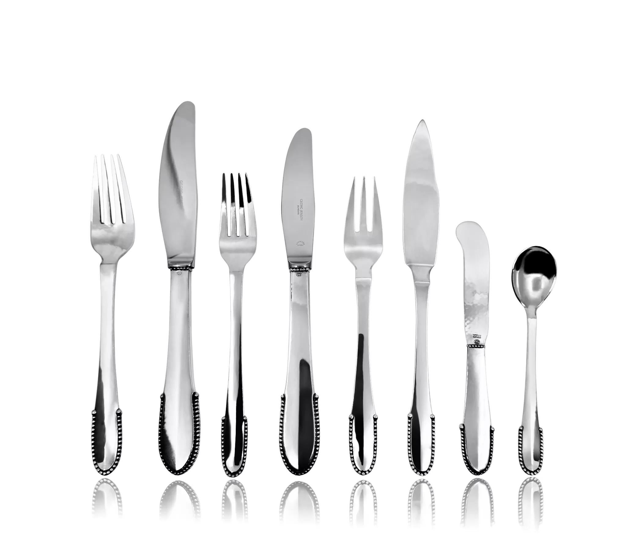 A complete Georg Jensen Beaded sterling silverware set, designed by Georg Jensen in 1916, featuring sought-after pieces such as fish knives and forks, along with butter spreaders.

Includes:
12 Dinner forks (7 1/8
