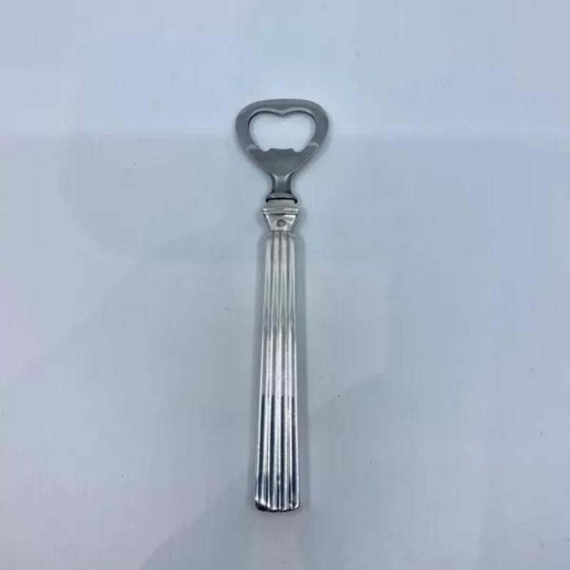 Georg Jensen bottle opener with sterling silver handle and stainless steel opener, the long handle version, item #272 in the Bernadotte pattern, design #9 by Sigvard Bernadotte from 1938.

Additional information:
Material: Sterling silver
Style: Art