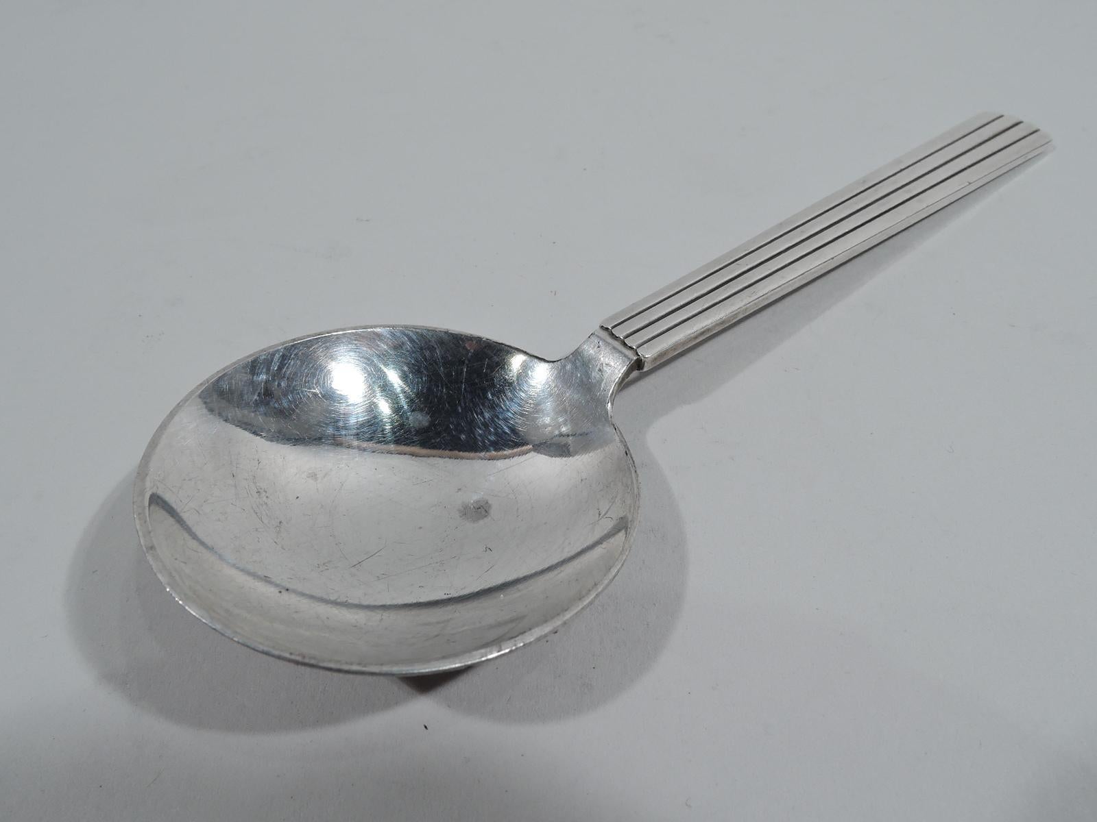 Bernadotte sterling silver cream soup spoon. Made by Georg Jensen in Copenhagen. Round bowl and tapering pilaster handle. An early piece in this pattern that was first produced in 1939. Fully marked including domestic maker’s stamp (1945-51).