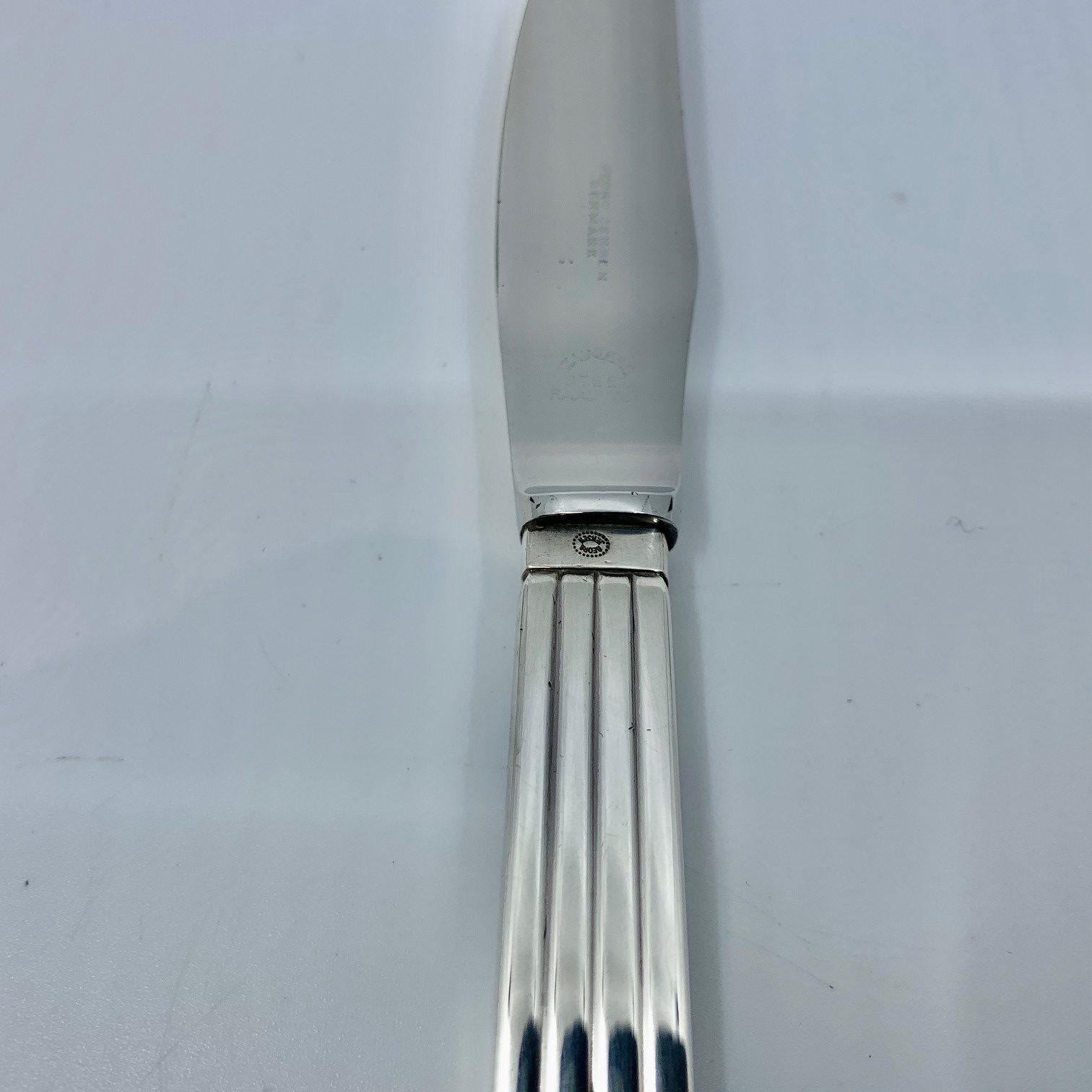 This is a Georg Jensen sterling silver luncheon/salad knife (stainless steel blade), item 024 in the Bernadotte pattern, design #9 by Sigvard Bernadotte from 1939.

Additional information:
Material: Sterling silver, stainless steel
Styles: Art