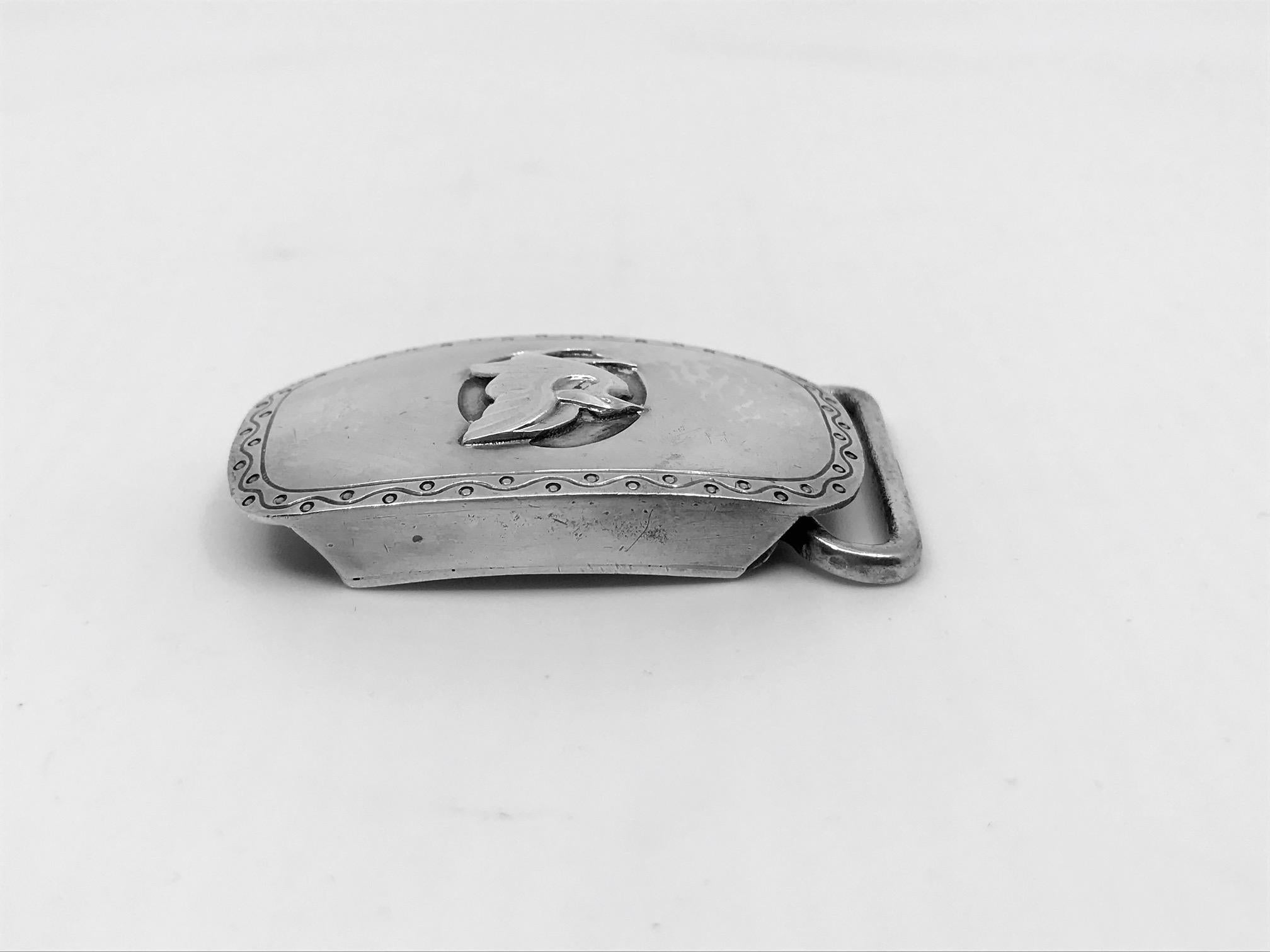 Sterling silver Georg Jensen belt buckle with stylistic bird motif, design #52 by Georg Jensen.
The buckle without the ring measures 1 7/8″ x 1 3/16″ (4.8cm x 3cm).
Post 1944 Georg Jensen hallmarks.