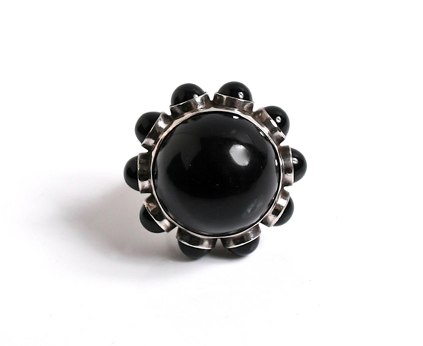 Rare vintage Georg Jensen sterling silver & black onyx ring designed by Astrid Fog Denmark c.1970 
Design number 166 comes in the original Georg Jensen box
The Onyx stones are perfect one large central stone with 10 smaller stones
Size K
